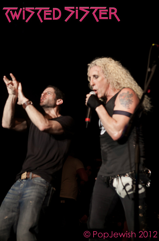 Rabbi Darby Leigh using sign language onstage in New York with Twisted Sister's lead singer Daniel "Dee" Snider