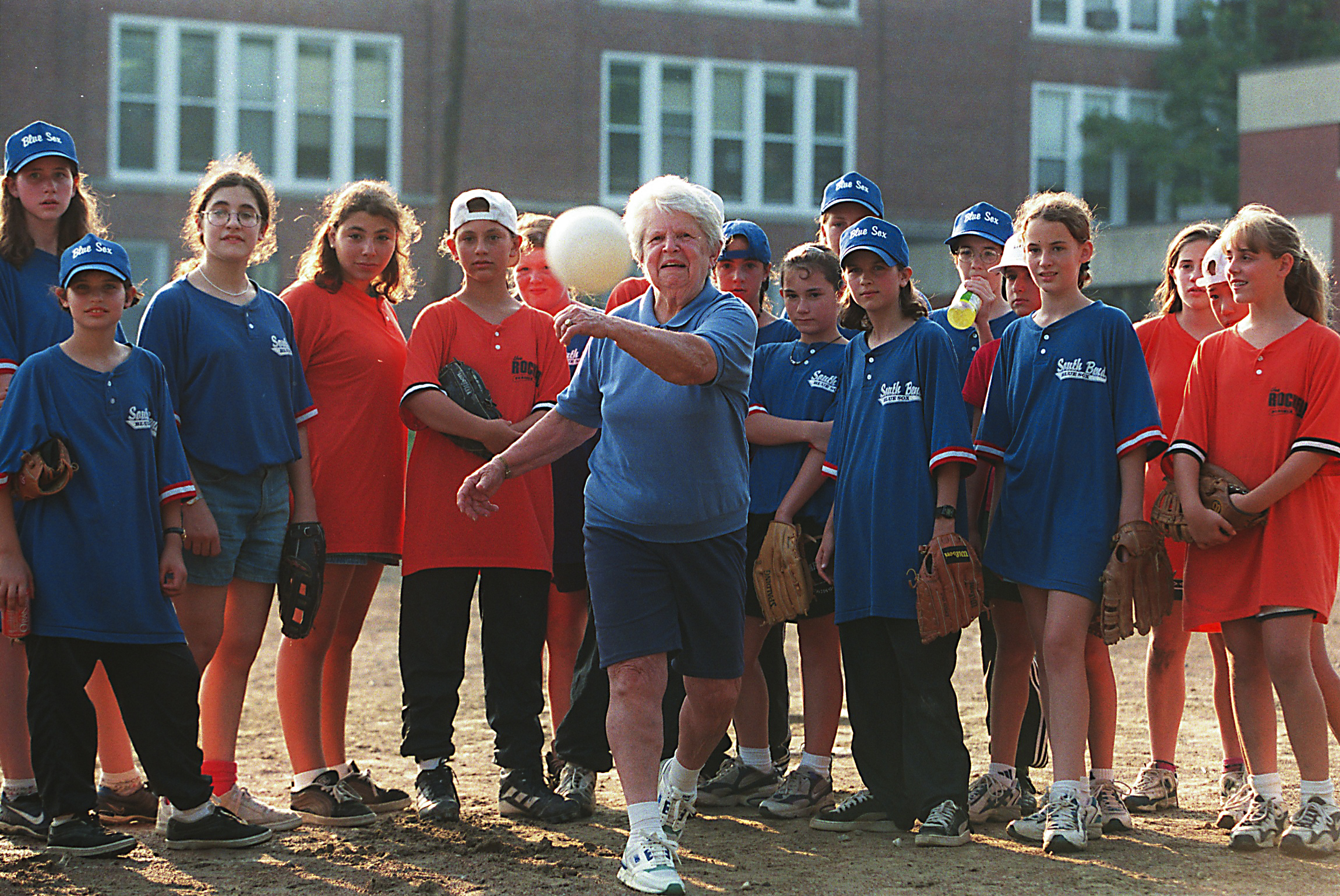 Ms. Pratt threw out the first pitch to start the Newton girls' softball summer league in 1998.