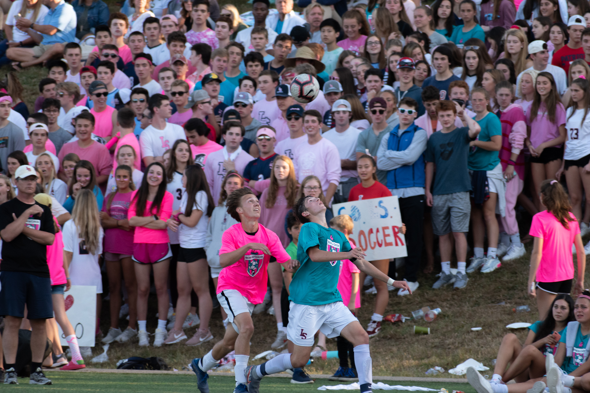 Levi Pierce (left) and Charlie Desmairais angle for the ball near the sideline at the “Kicks for Cancer” event.