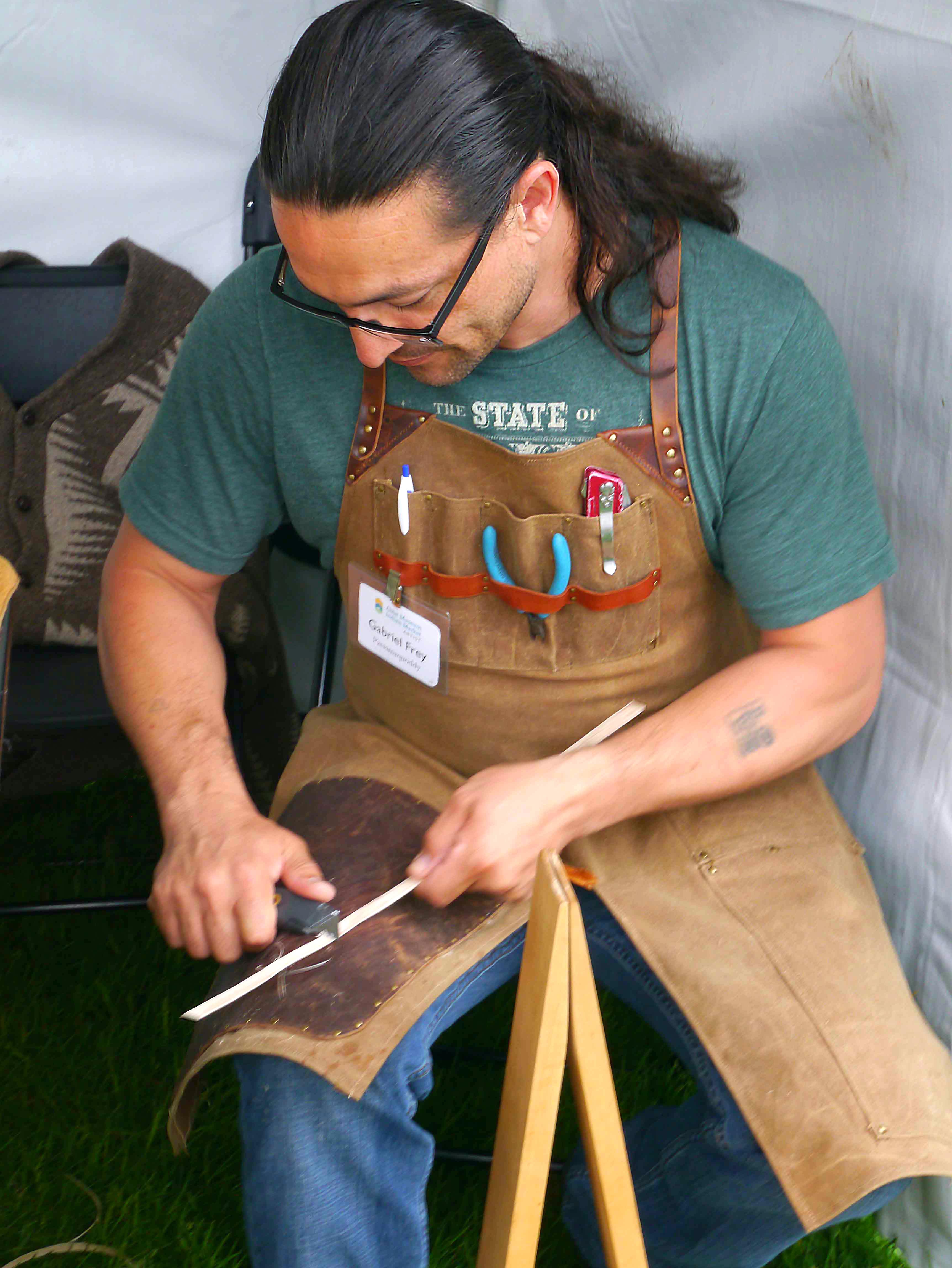 Passamaquoddy basketmaker Gabriel Frey demonstrated the creation of an ash splint for traditional basketry.