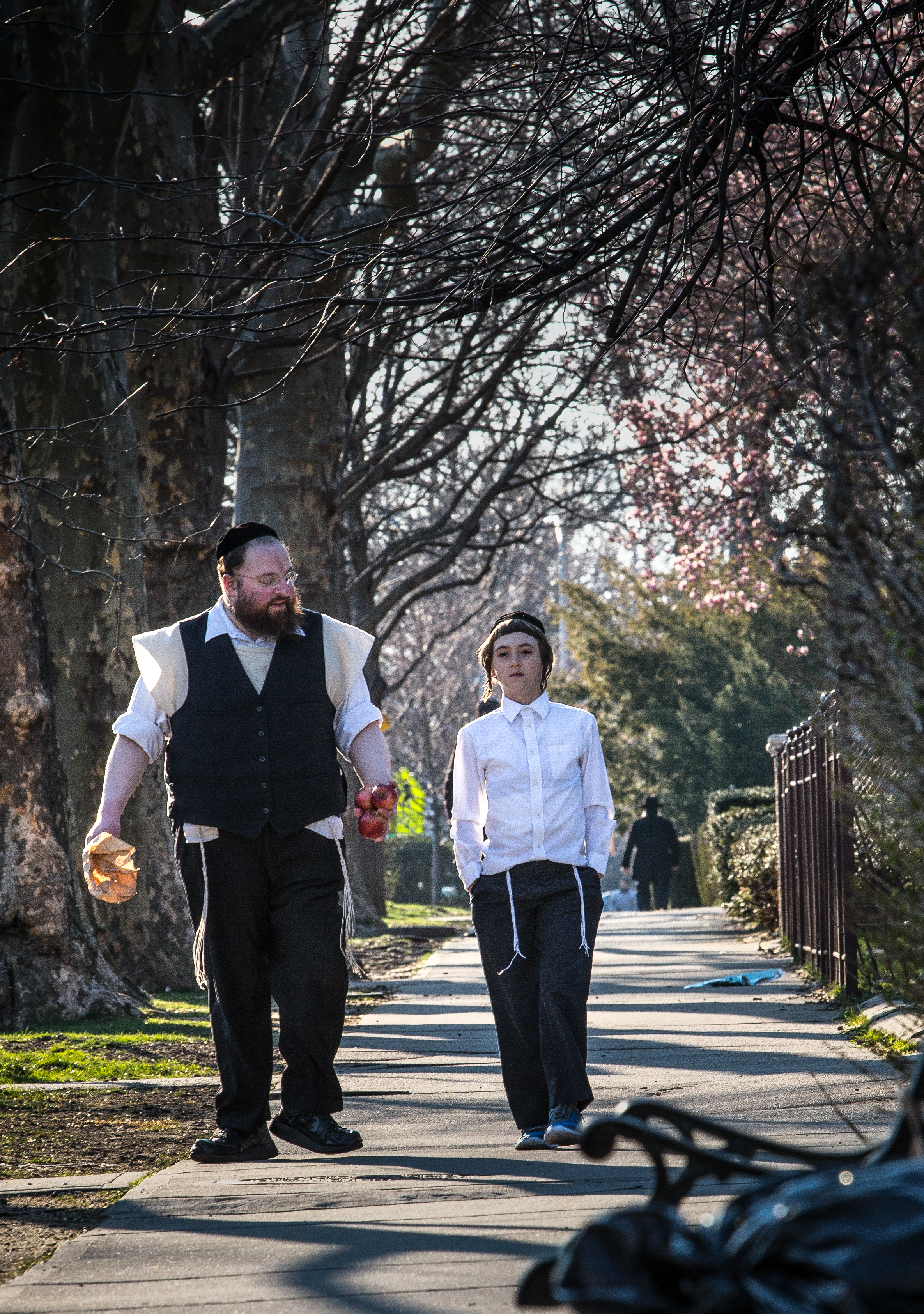 Menashe Lustig (far left) and Ruben Niborski in “Menashe.”