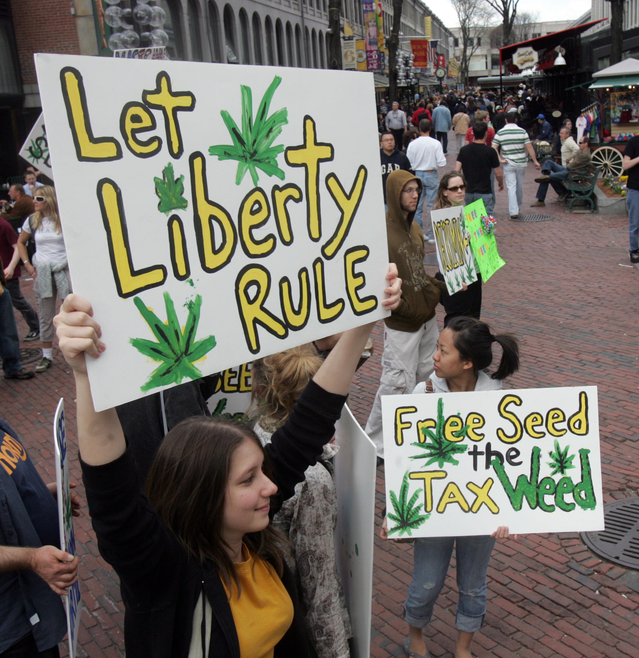 Members of the National Organization for Reform of Marijuana Laws held signs outside Quincy Market in 2007.
