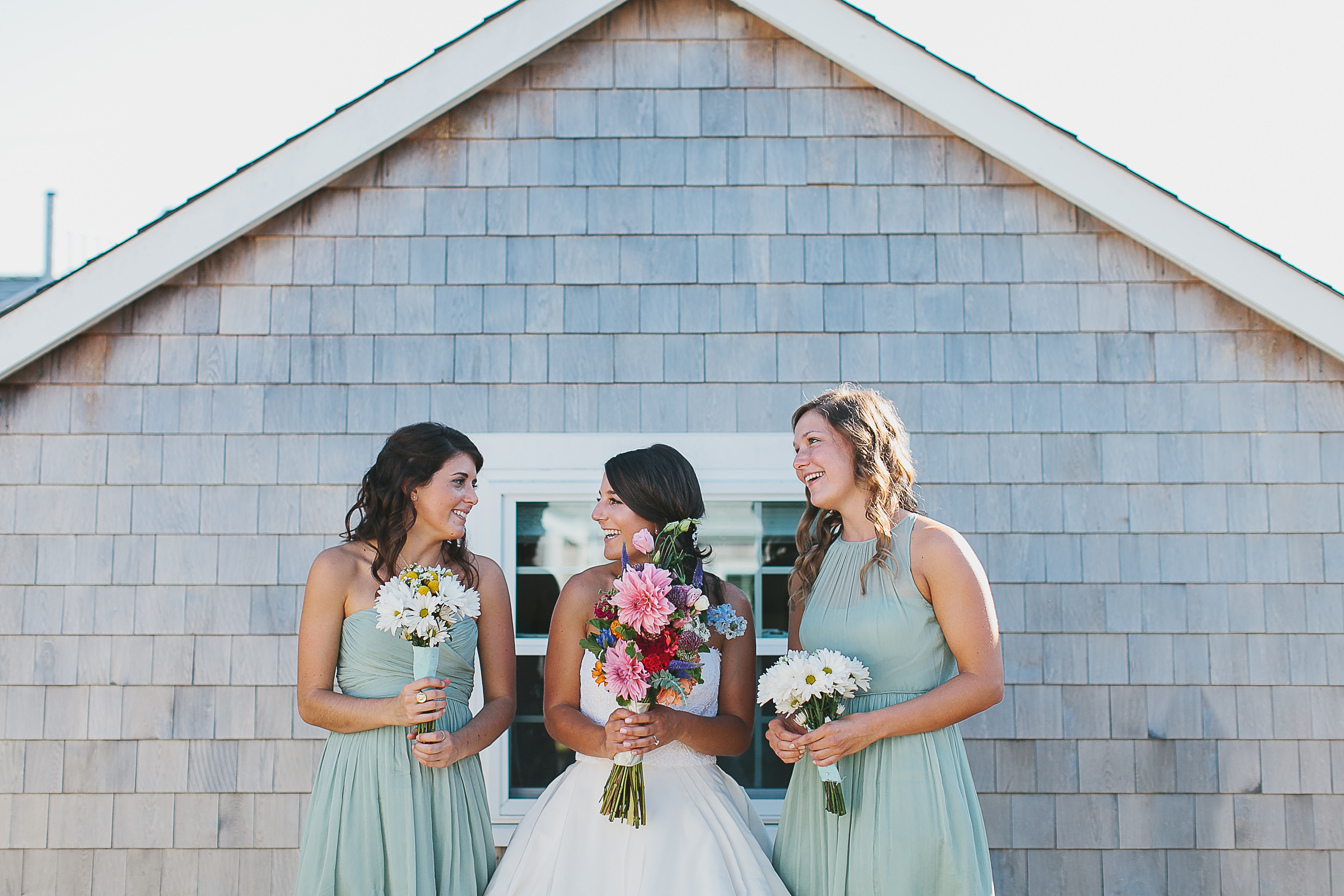 The bride’s gown came from Vows in Watertown, the attendants’ from J.Crew.
