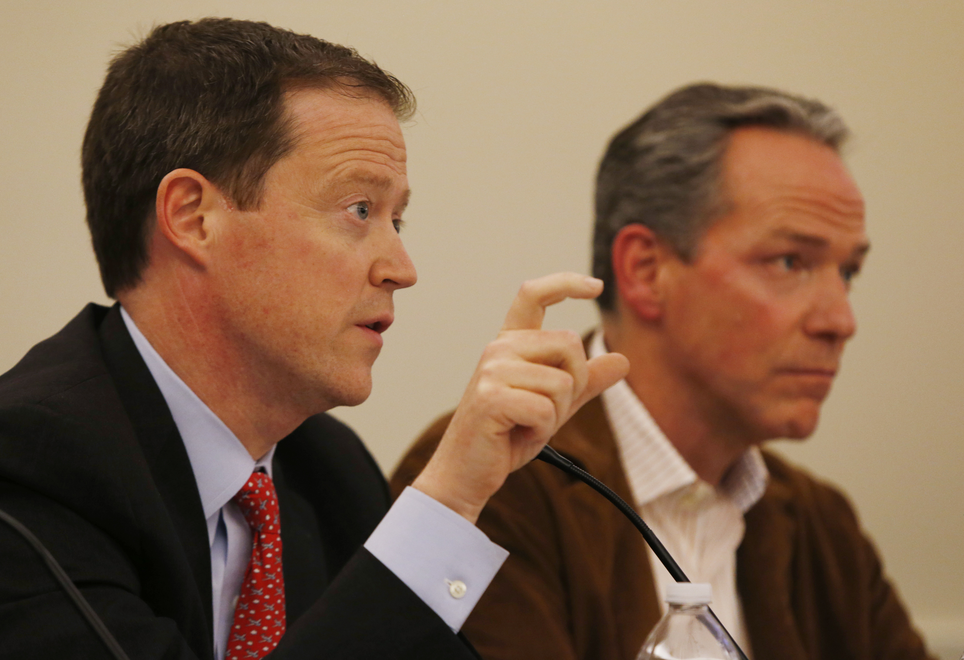 Boston 2024 CEO Richard Davey (left) answered a question. He was seated next to Boston 2024 chairman John Fish.