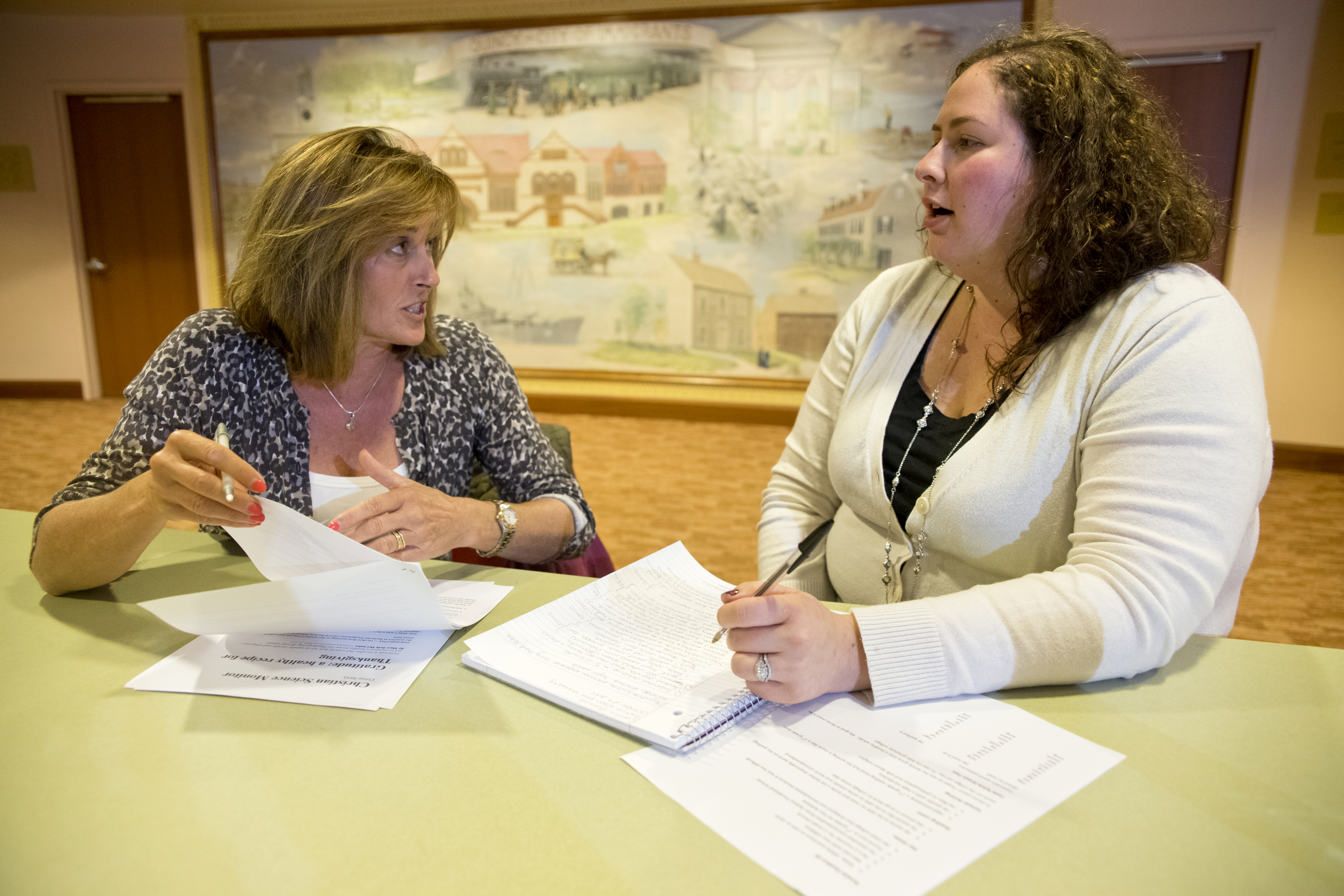 Carol O’Neill and Caitlin Castello Greene of Literacy Volunteers of Massachusetts-Quincy discuss teaching a student how to read.