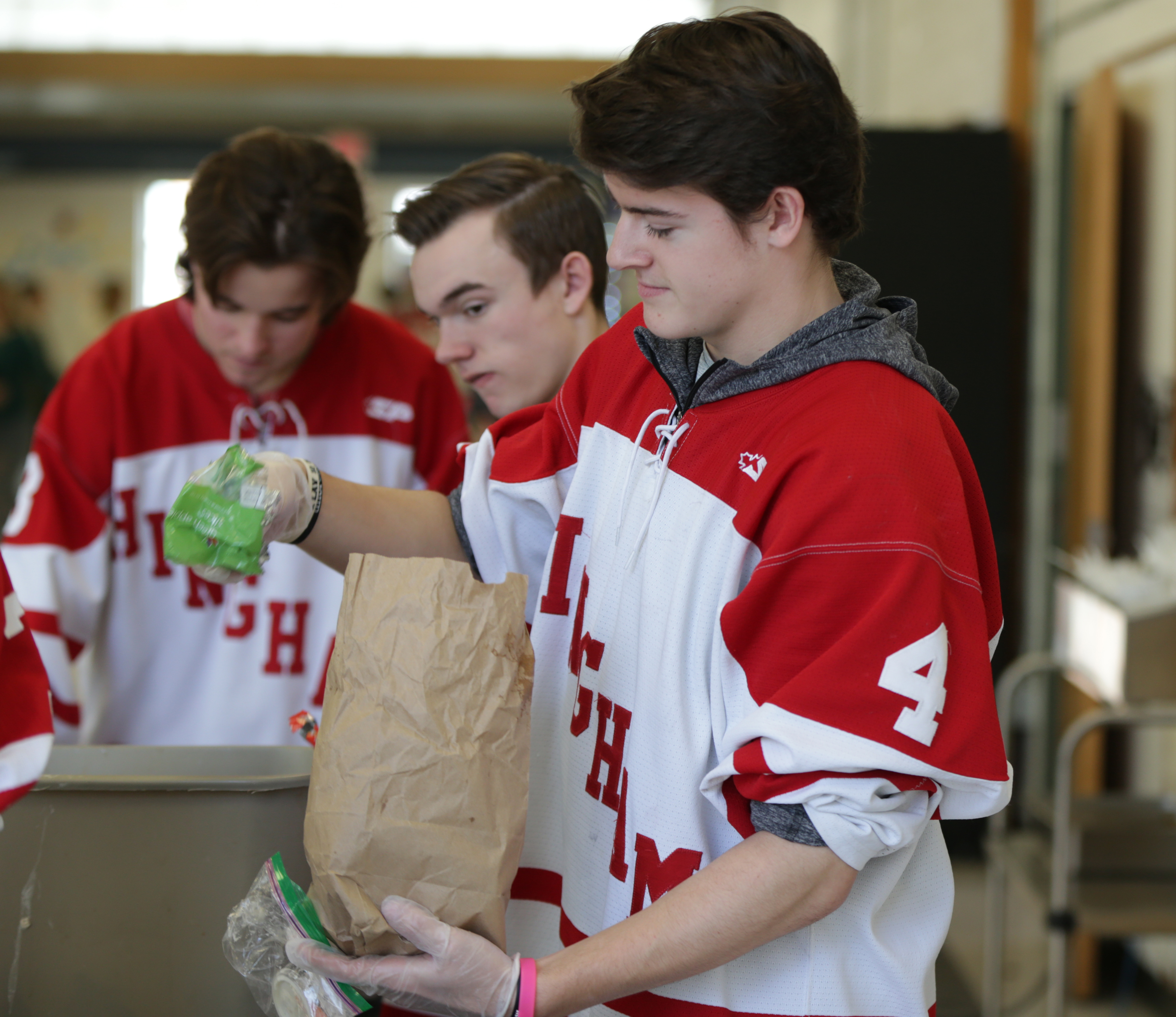 Hockey team member Jake Higgins and his teammates worked steadily through the end of the lunch period.