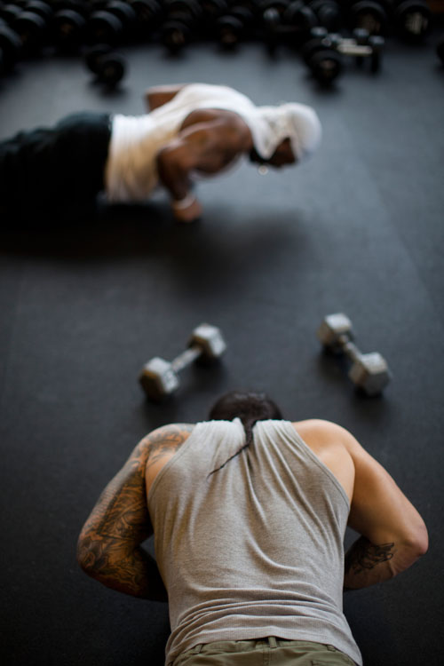 After years battling on the streets, Joe (in foreground) found a refuge and a purpose at InnerCity Weightlifting in Dorchester.