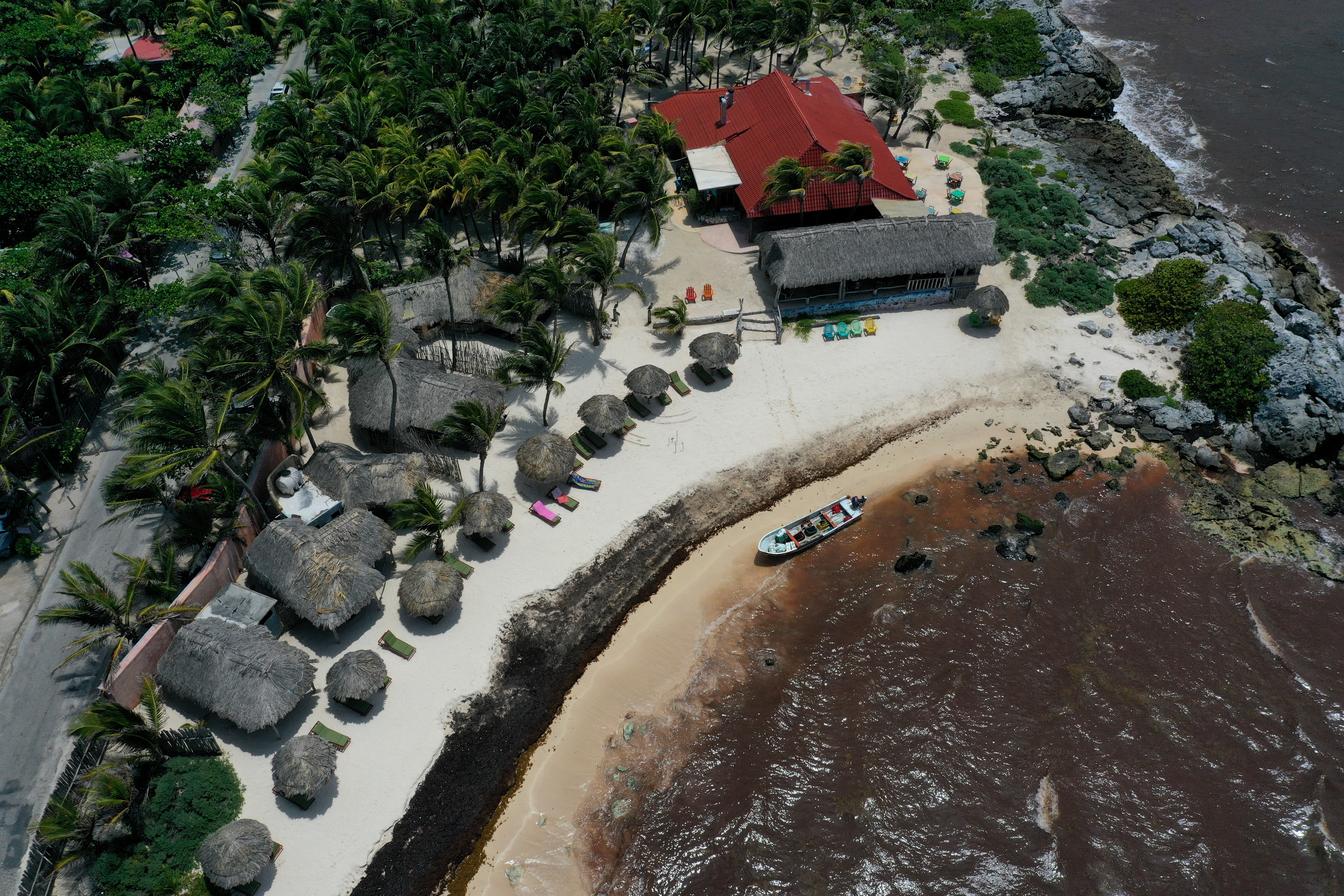 Waters near a Tulum resort were brown from sargassum, a seaweed-like algae, on June 15.