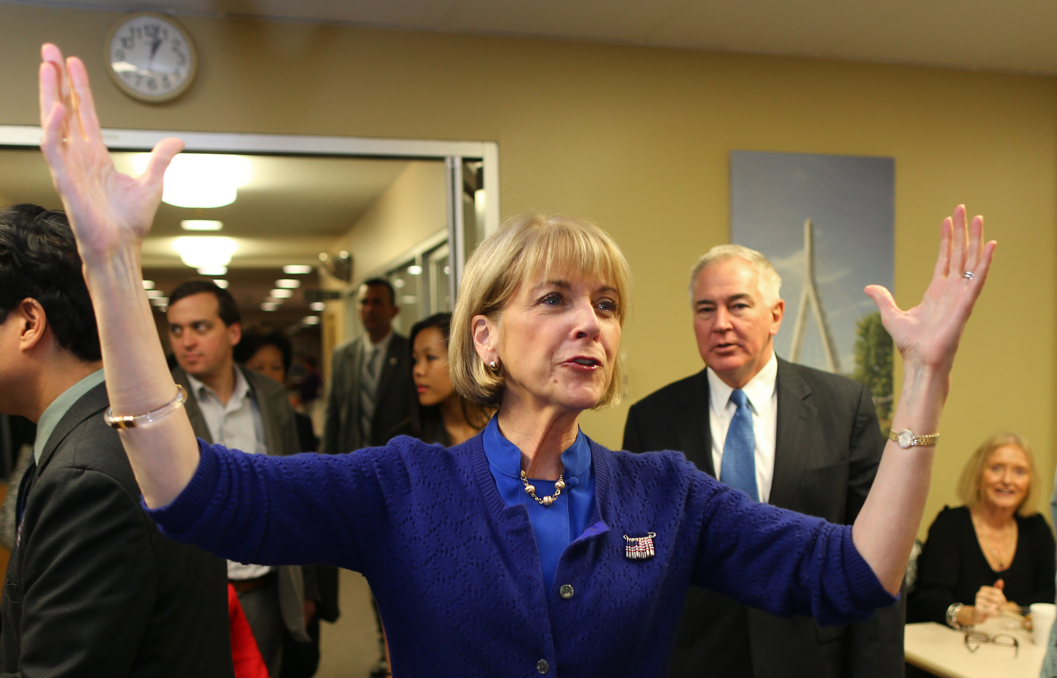 Martha Coakley in Quincy, with husband Thomas F. O’Connor Jr. not far behind her.