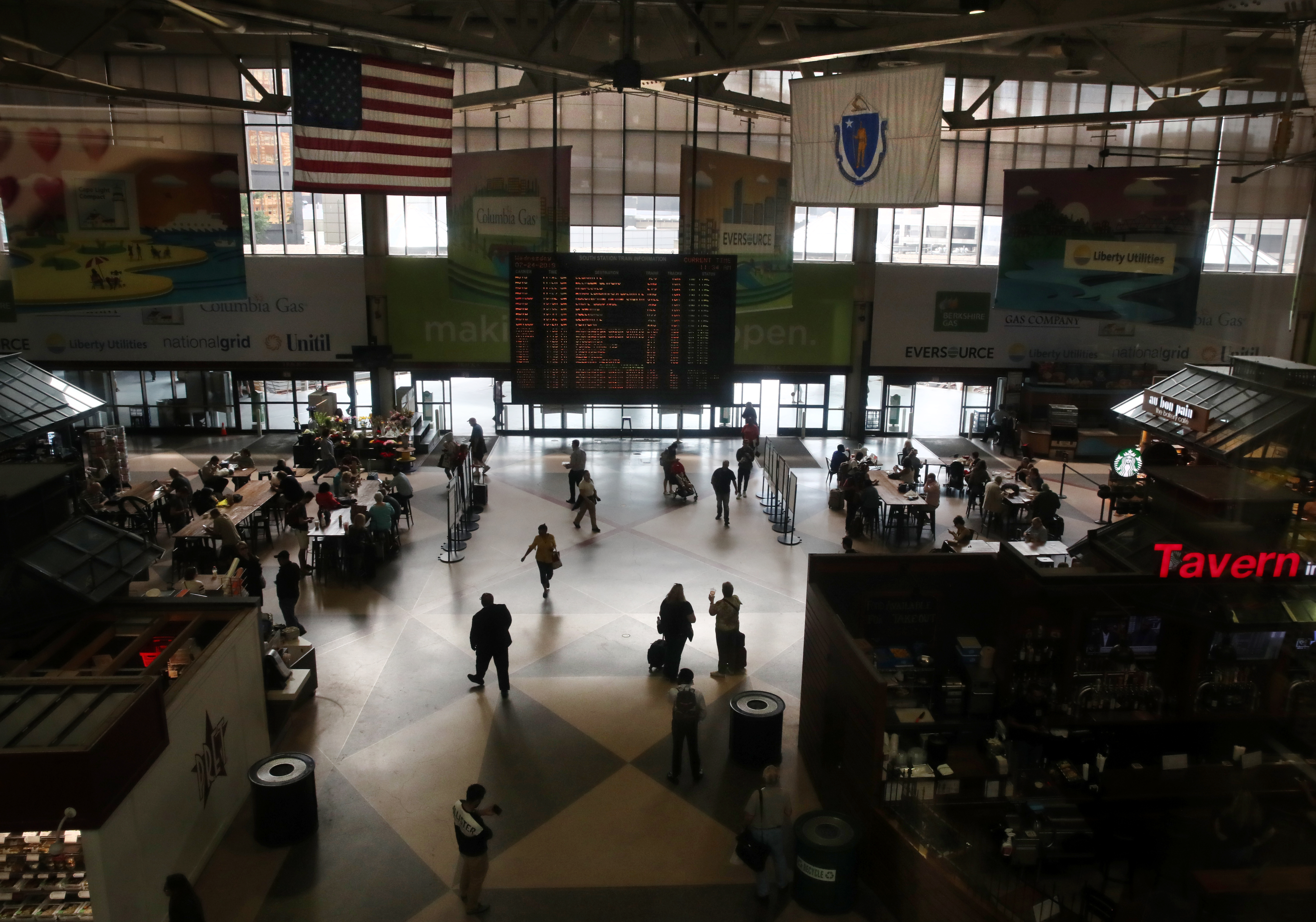 Commuters passed through South Station in Boston.