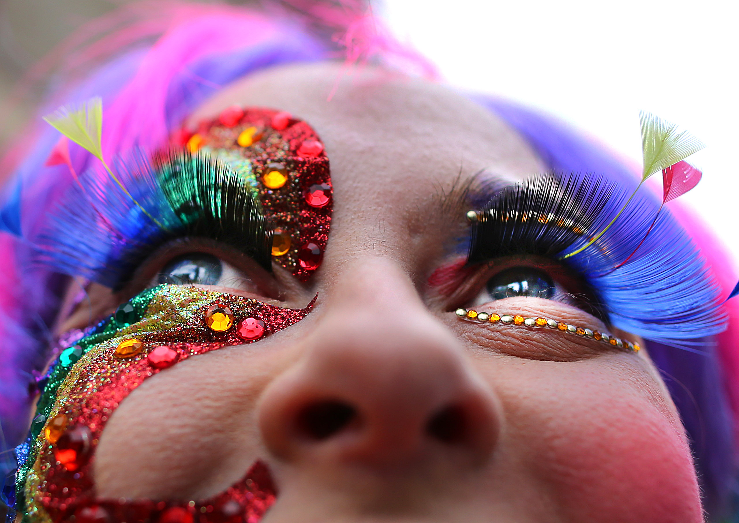 Leah Spivey of Tewksbury sported colorful eyelashes at the Boston gay pride parade, which had more than 15,000 marchers.