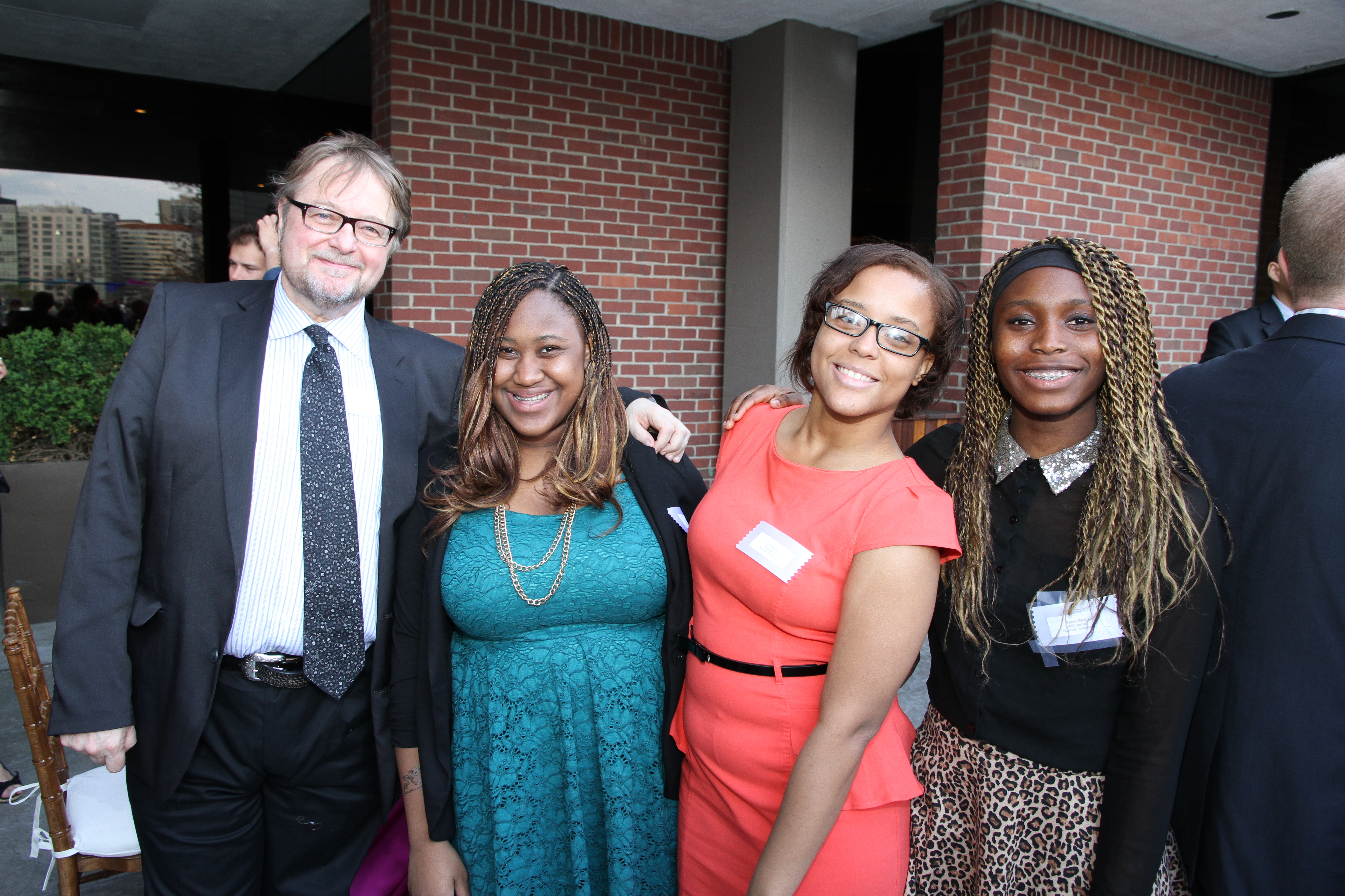 From left: writer Luis Alberto Urrea with 826 Boston students Stevelyn Desire, Julia Teixeira, and Agnes Ugoji at the benefit.