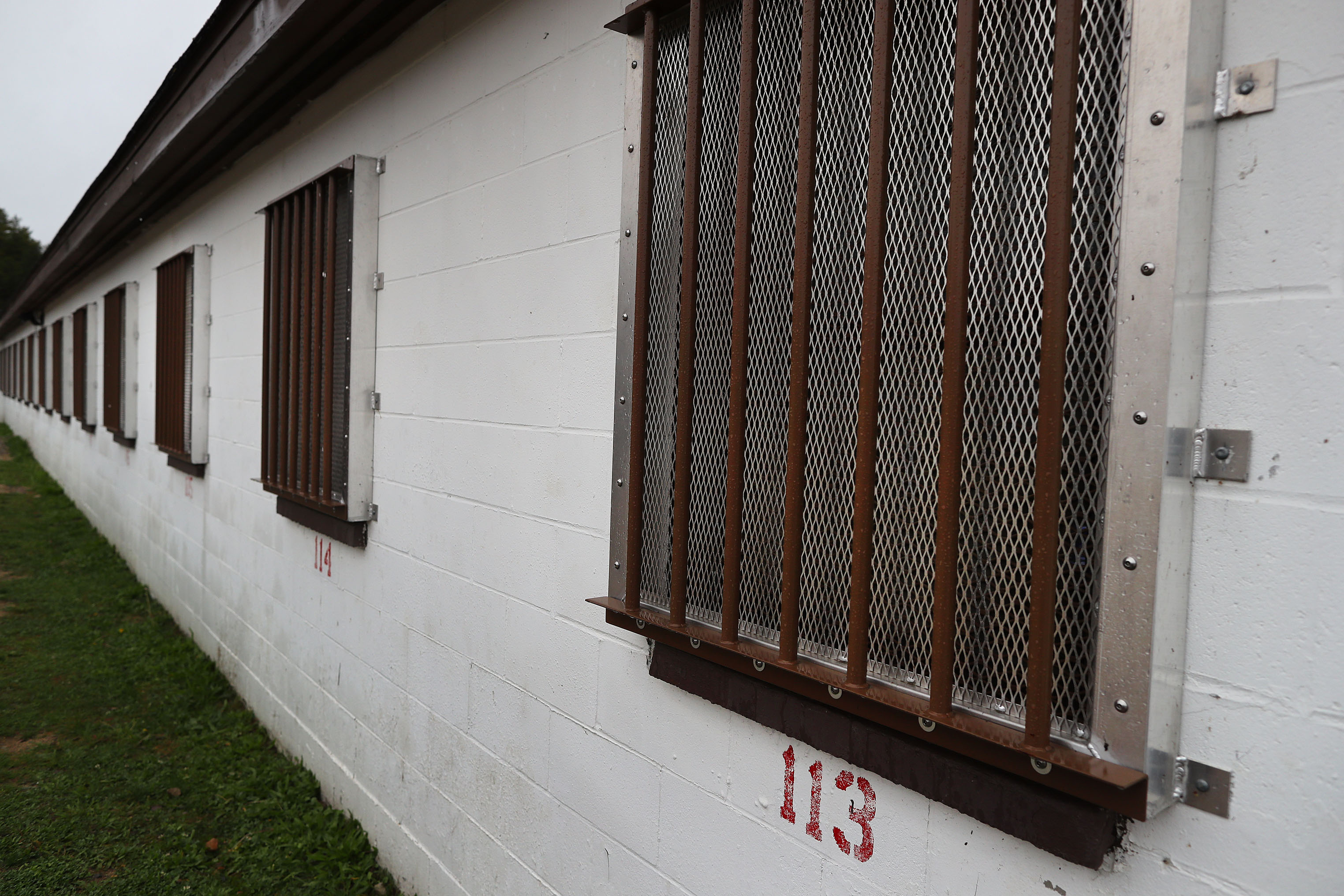 Windows for inmates’ cells have bars on them.