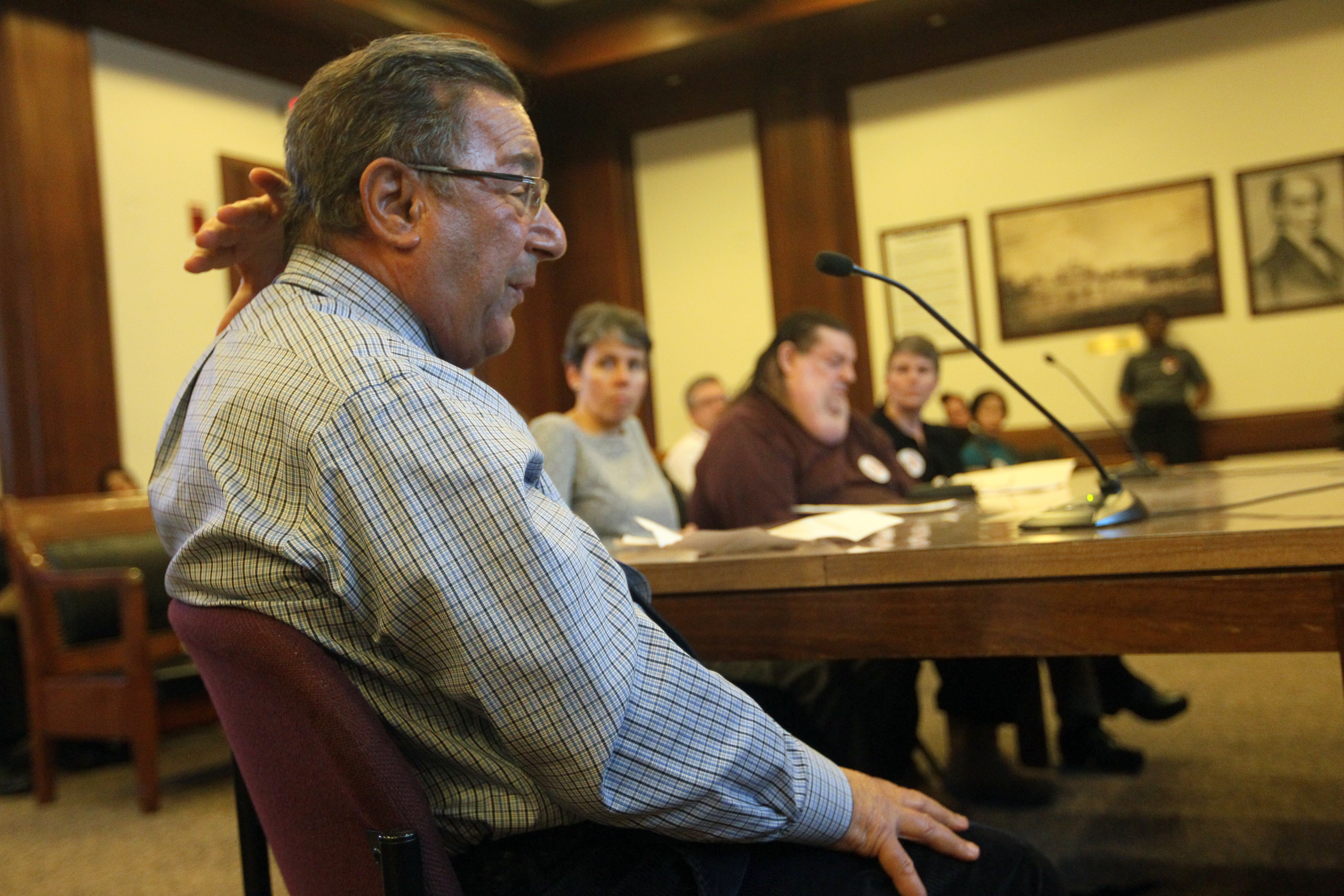 Dr. John M. Mazzullo, an assistant clinical professor of medicine at Tufts Medical Center, testifies at the State House about lipodystrophy, a condition caused by some<br/>HIV treatments.