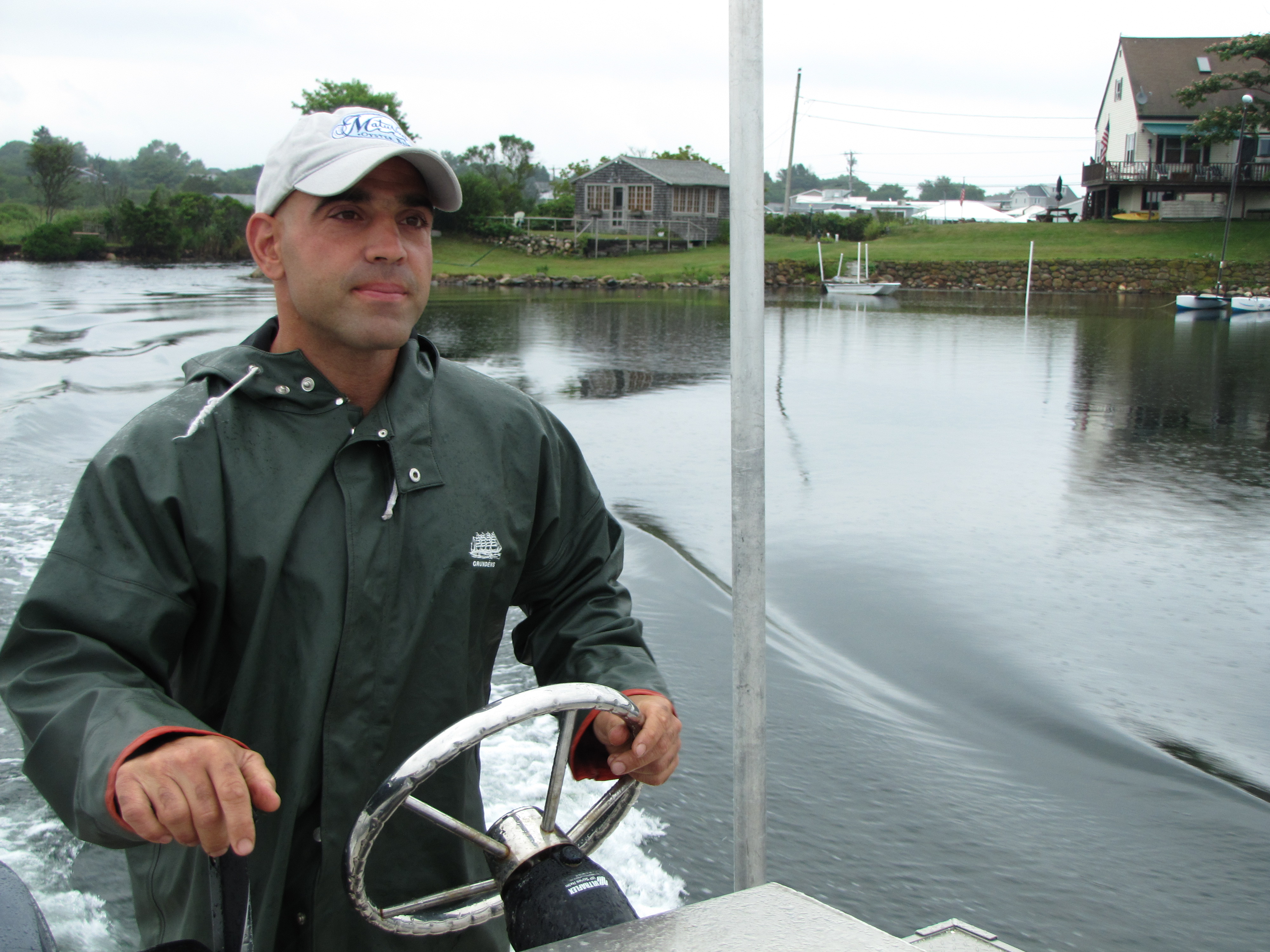 Owner Perry Raso, the restaurant dock behind him, manages the restaurant, the aquaculture farm, and the oyster sales business.