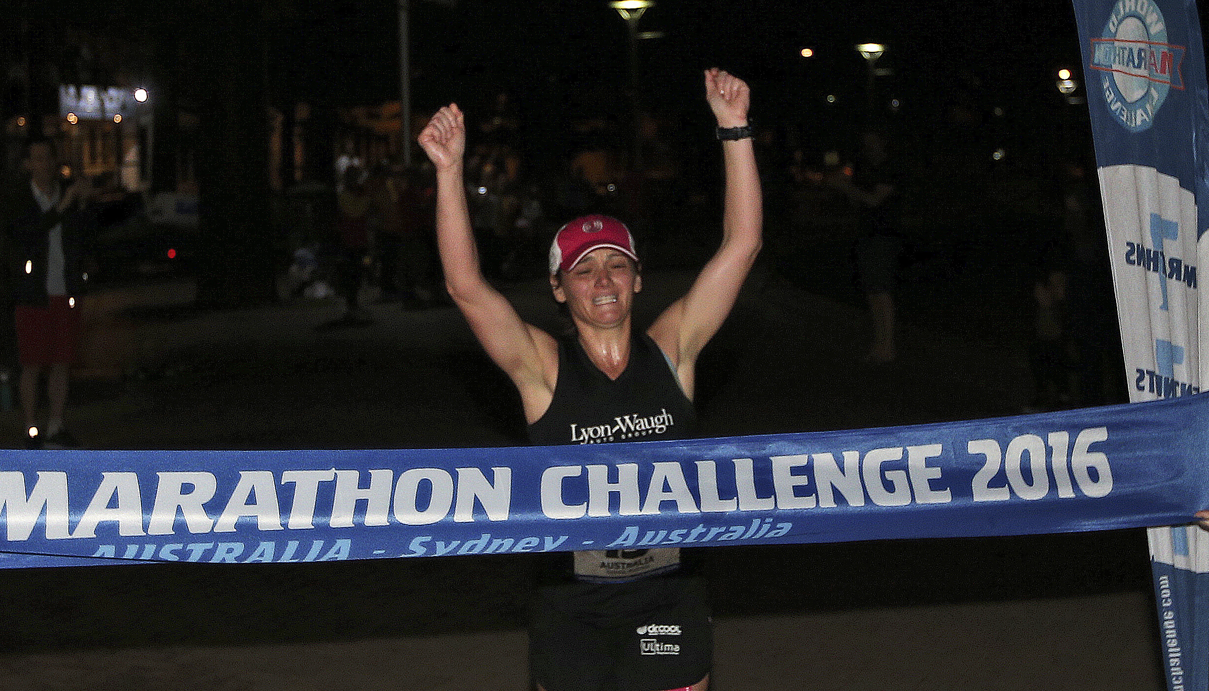 Becca Pizzi of Belmont crossed the finish line of the final leg of the World Marathon Challenge early Saturday morning in Australia.