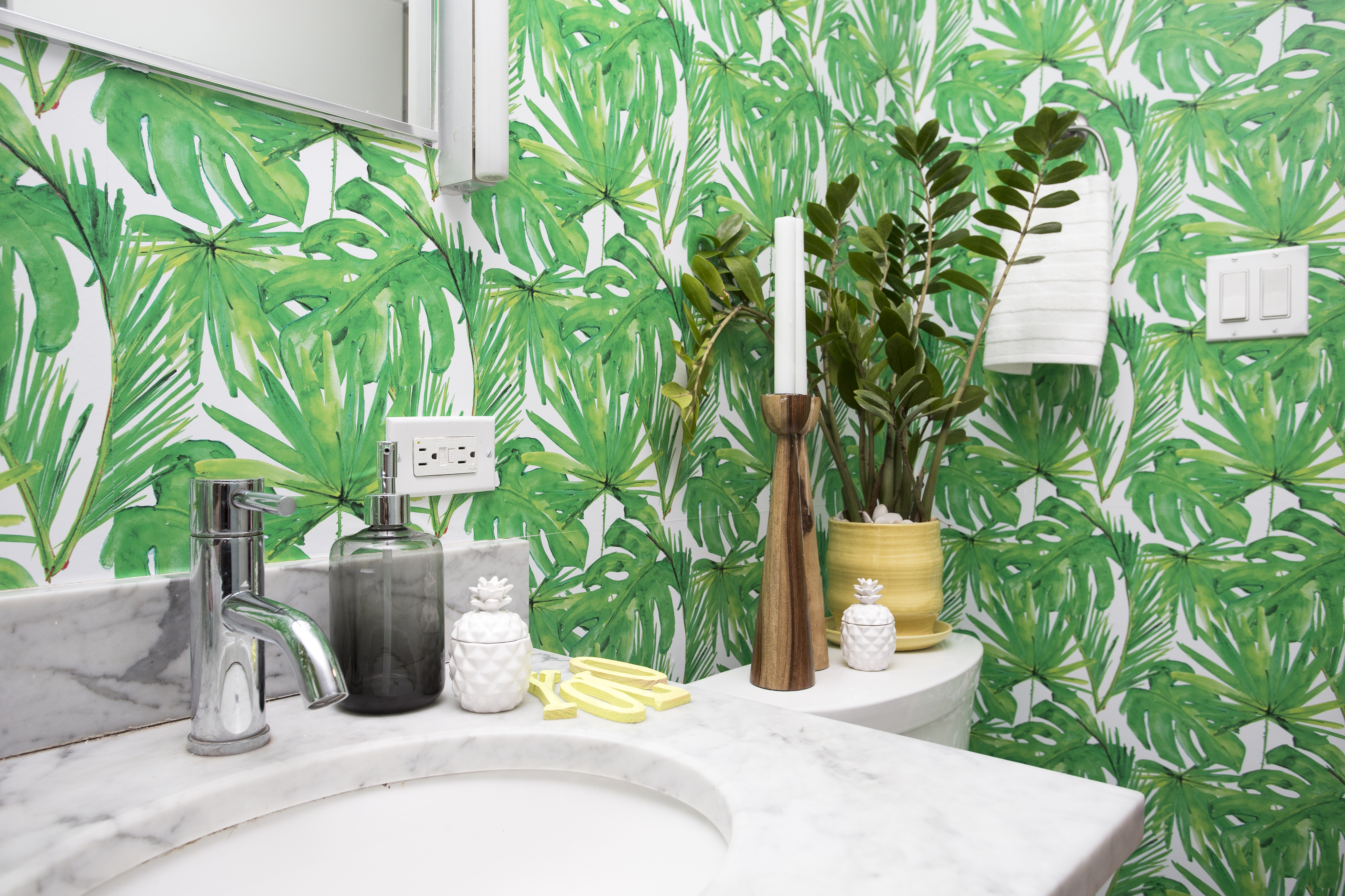 Shelly Lynch-Sparks chose a foliage wallpaper for a bathroom.