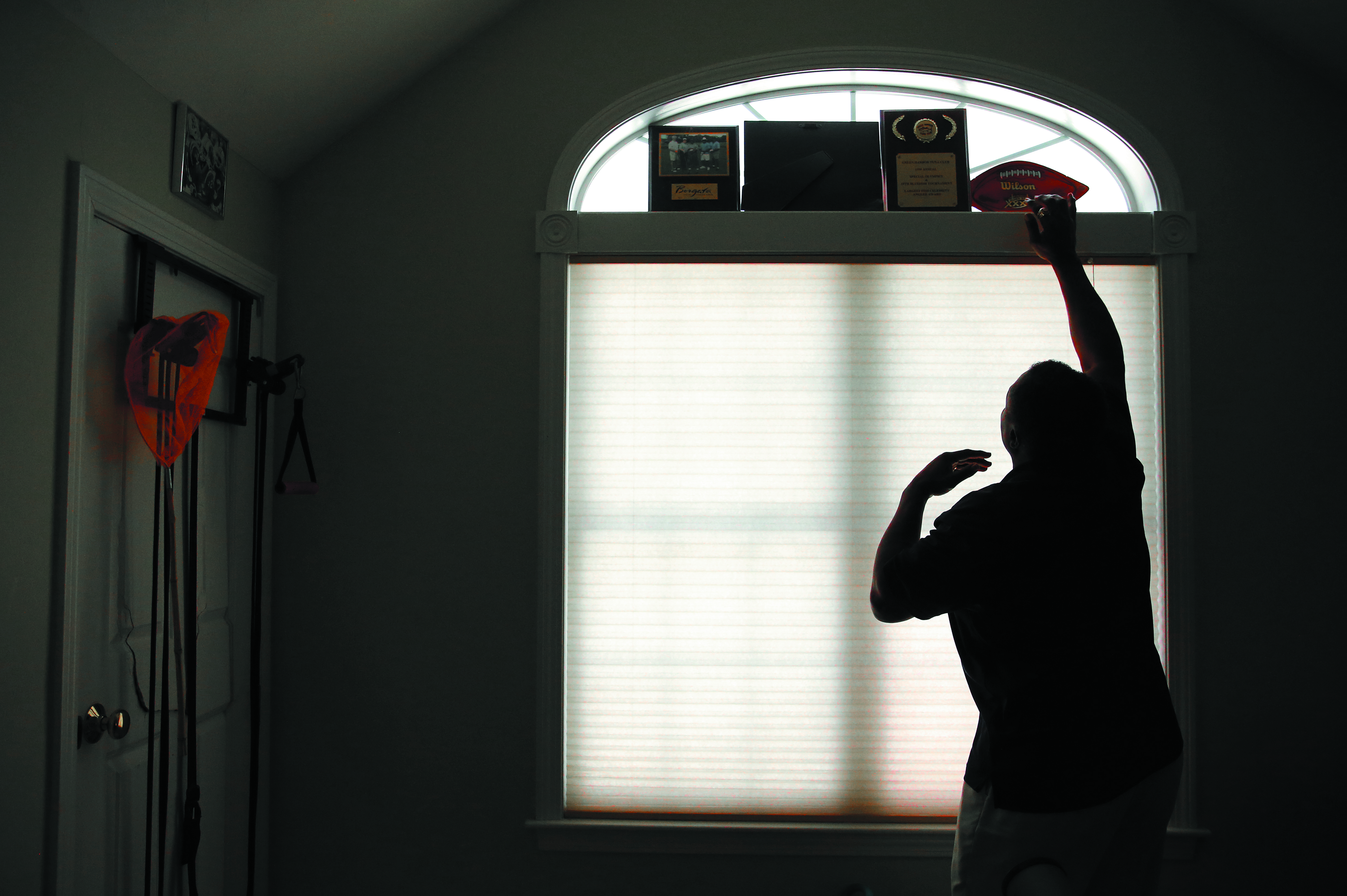 Lippett used plaques and other honors to block the light in his room. He said he probably spends 95% of his time in his room. He listens to the bible and soft music, watches old movies and keeps the light low.