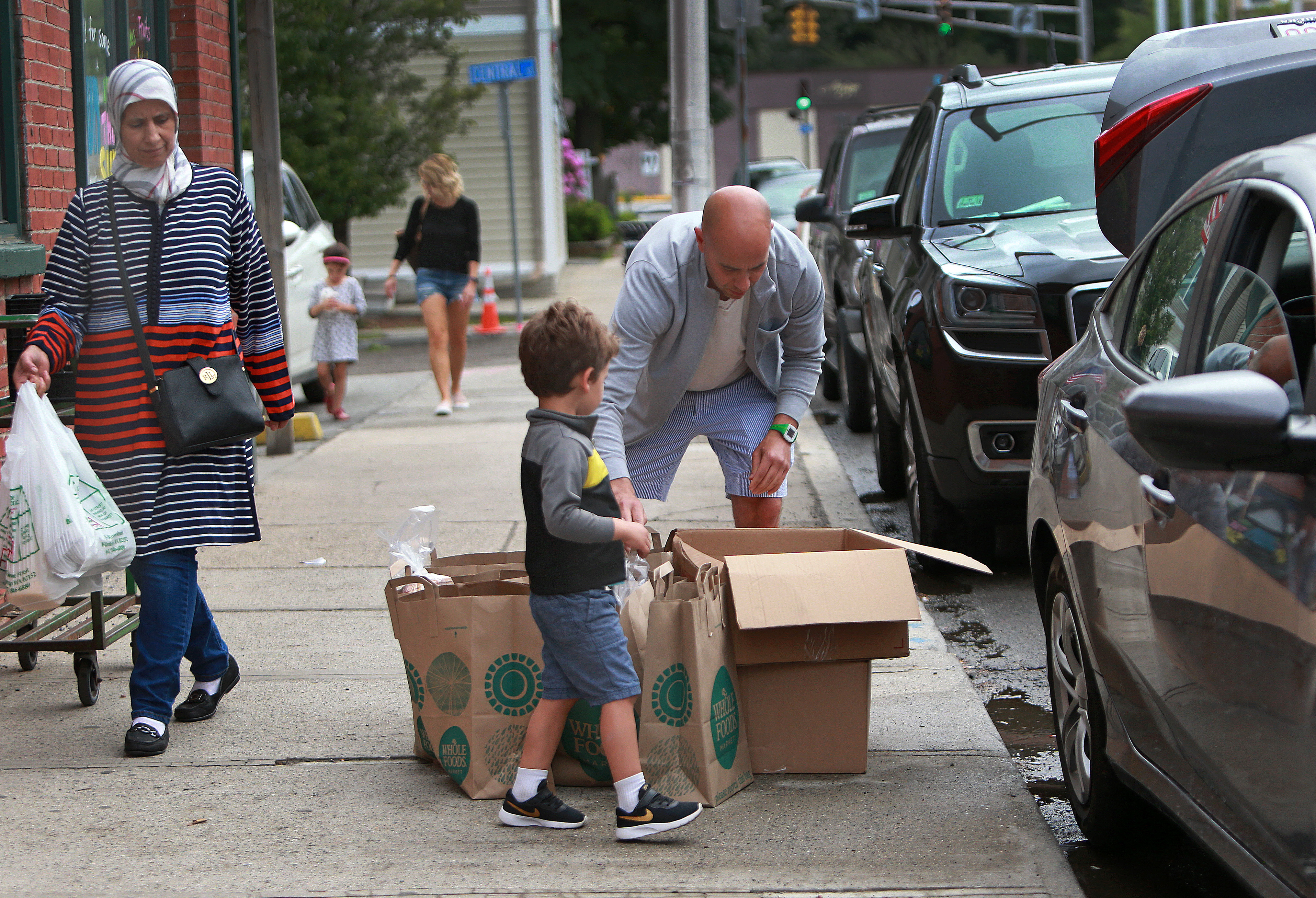 Carson and his son got ready to distribute boxes of groceries in Winthrop.