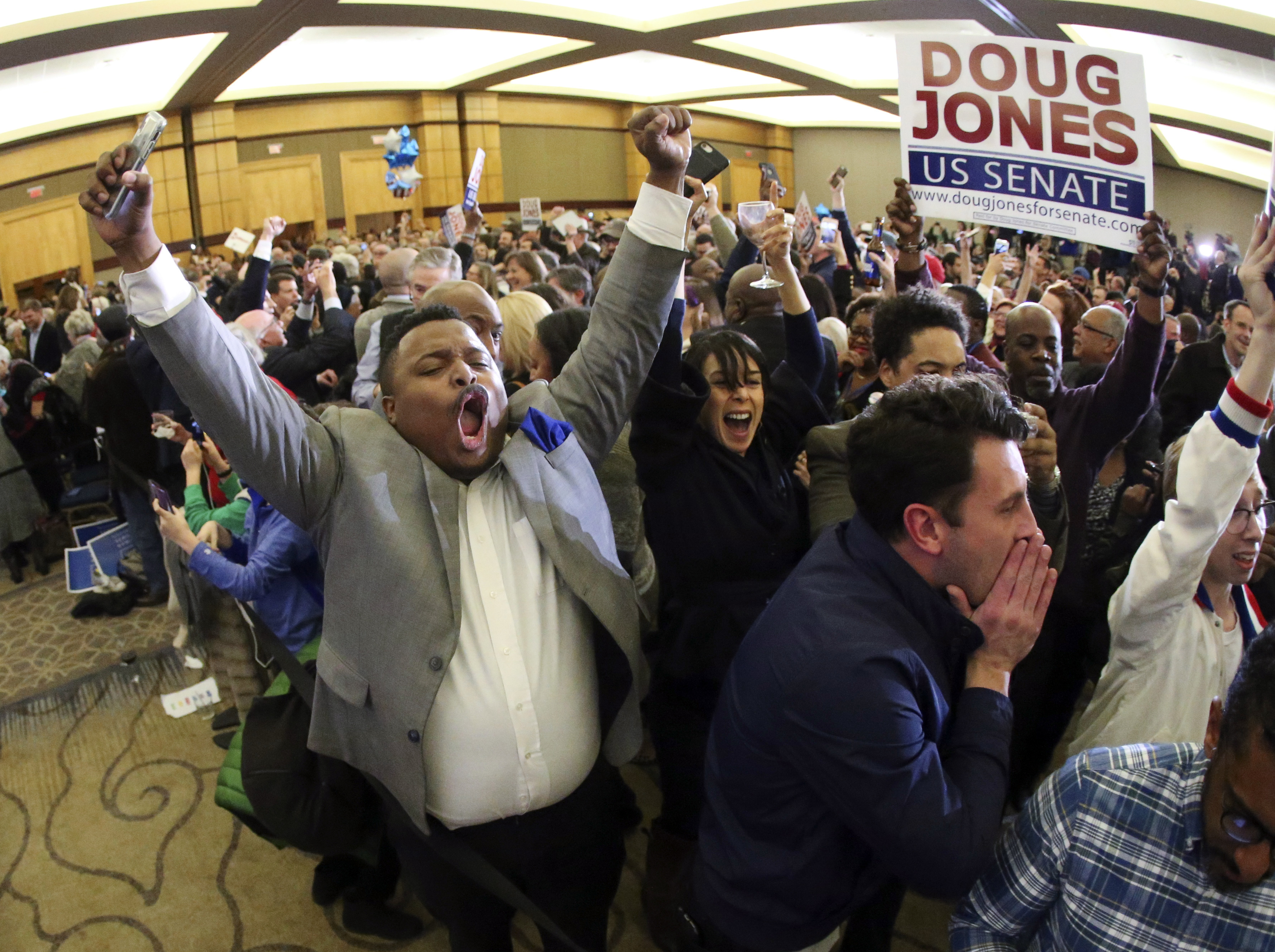 Supporters of Doug Jones erupted is celebration during an election-night watch party Tuesday.