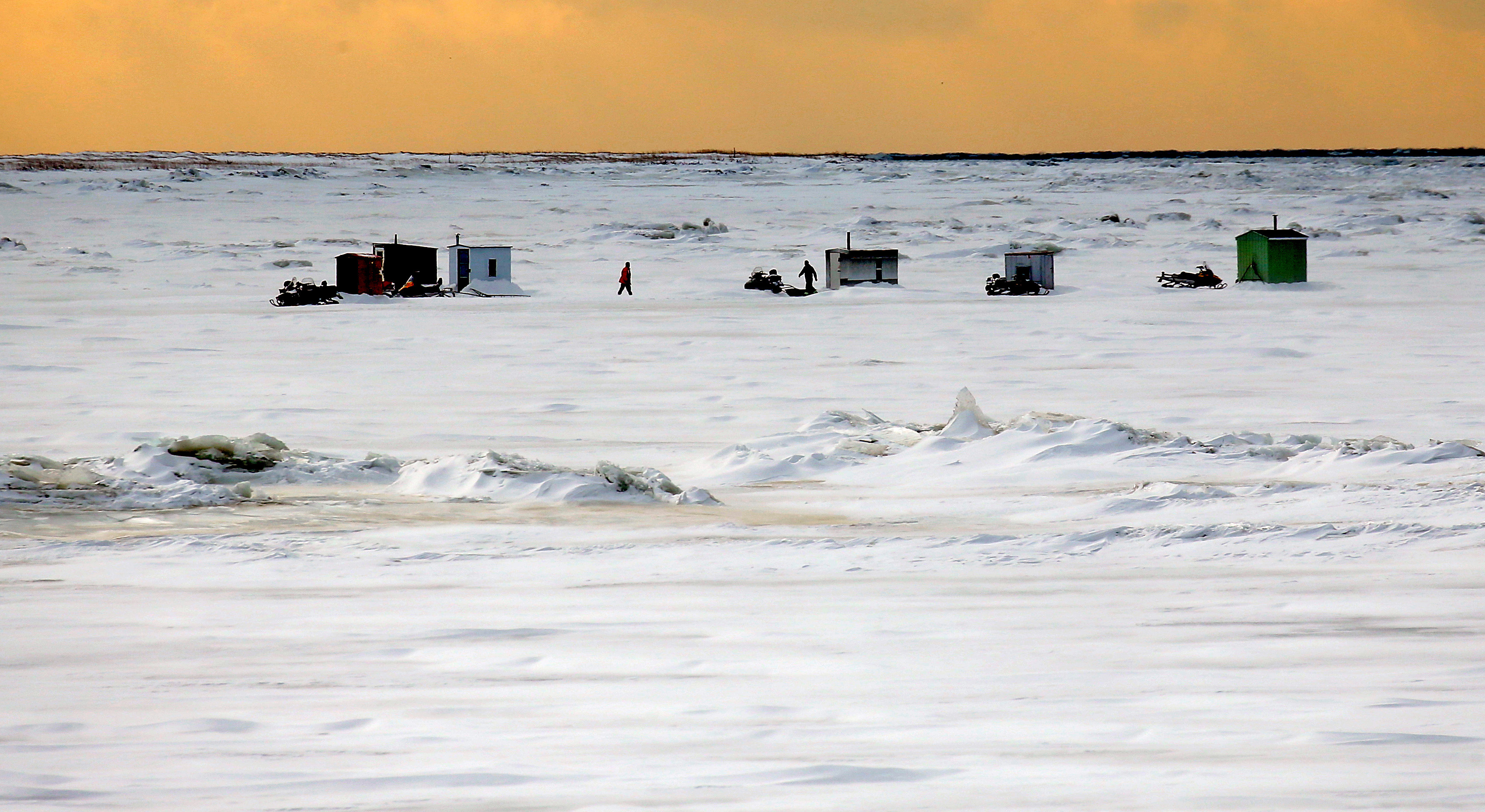 Power plants on Quebec’s rivers can clash with native ways of life, such as ice fishing on the Outardes River.