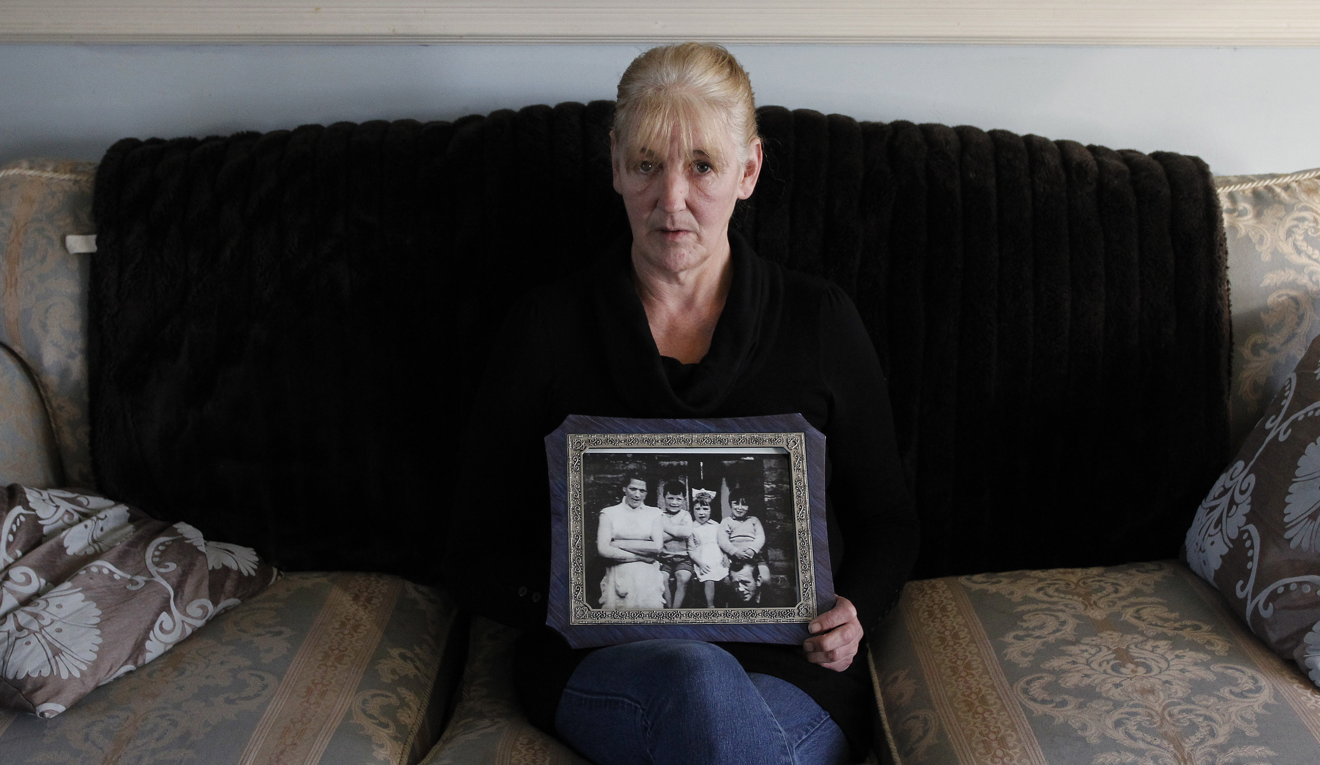 Helen McKendry held a family photo showing her mother, Jean McConville, at home in Killyleagh, Northern Ireland.
