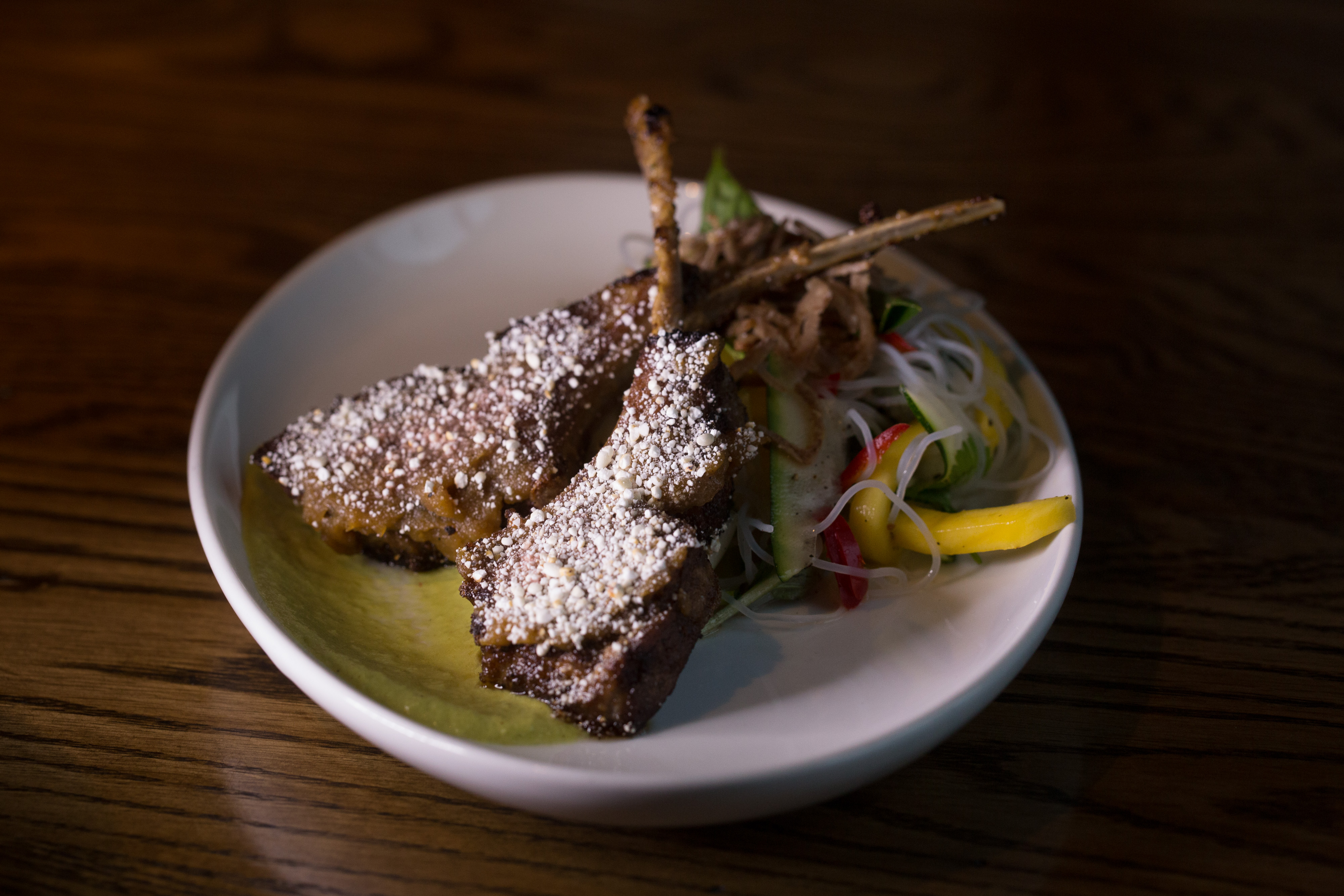 At Blue Dragon, tamarind-glazed lamb lollipops with glass noodle salad.