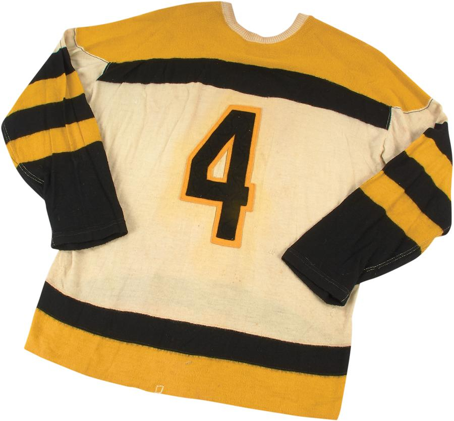 A No. 4 Bruins jersey worn by hard-hitting defenseman Bob Armstrong has sold for nearly $20,000, according to the online auction house Lelands.com.