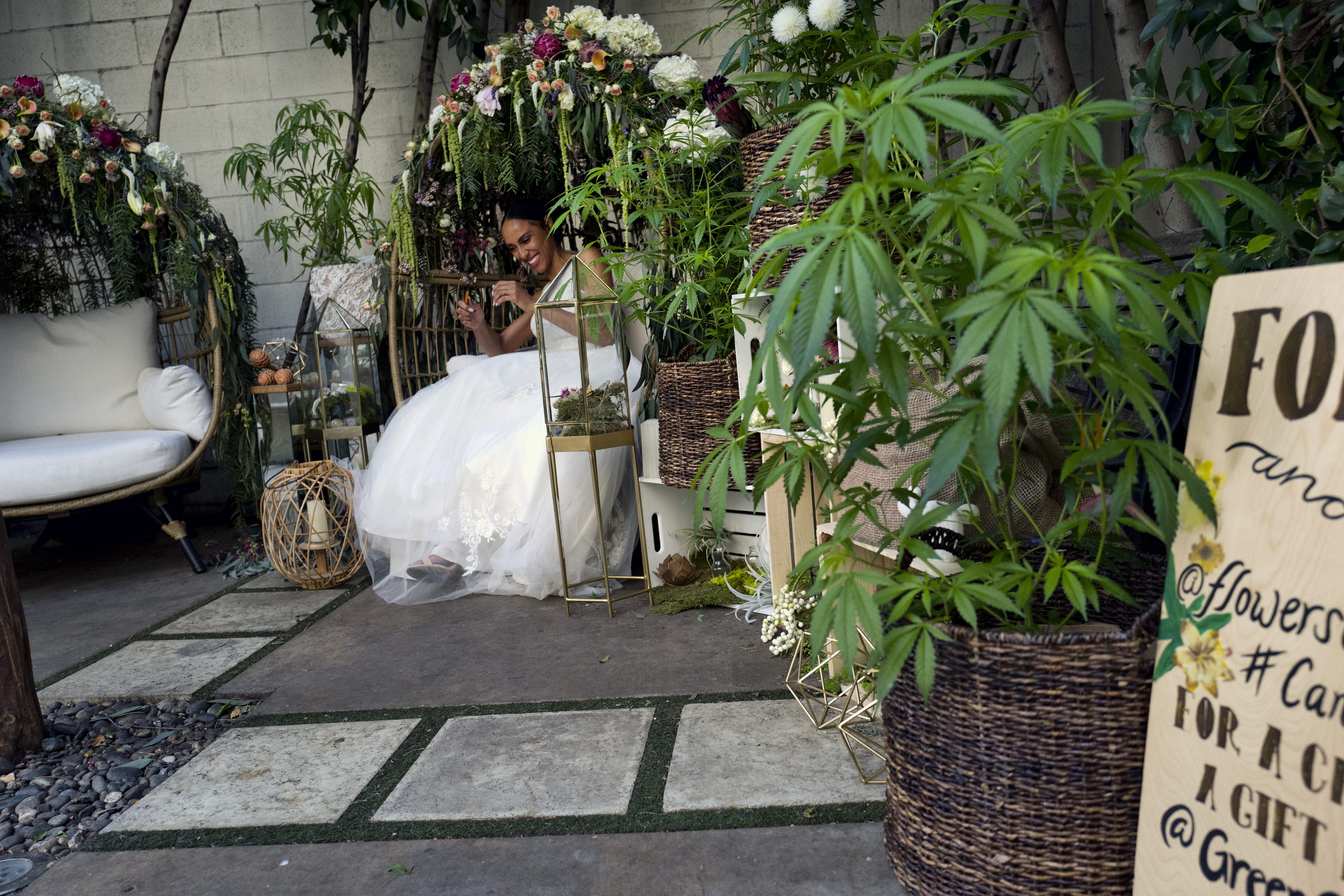 A model poses for a photo wearing a designer wedding dress.