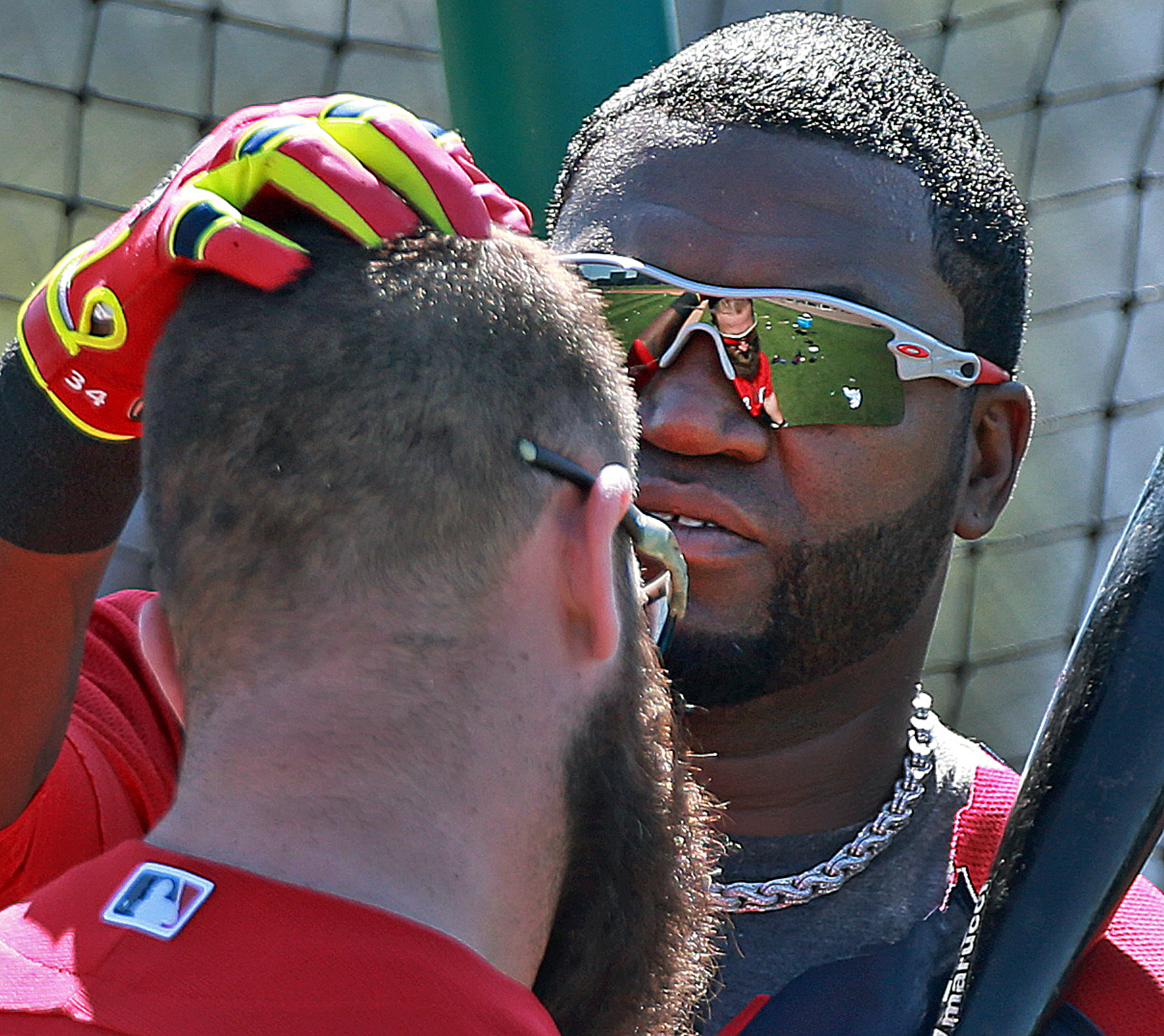 Back in camp, David Ortiz greeted teammate Mike Napoli with a pat on the head and later gave his opinion on the media reaction to his contract request.