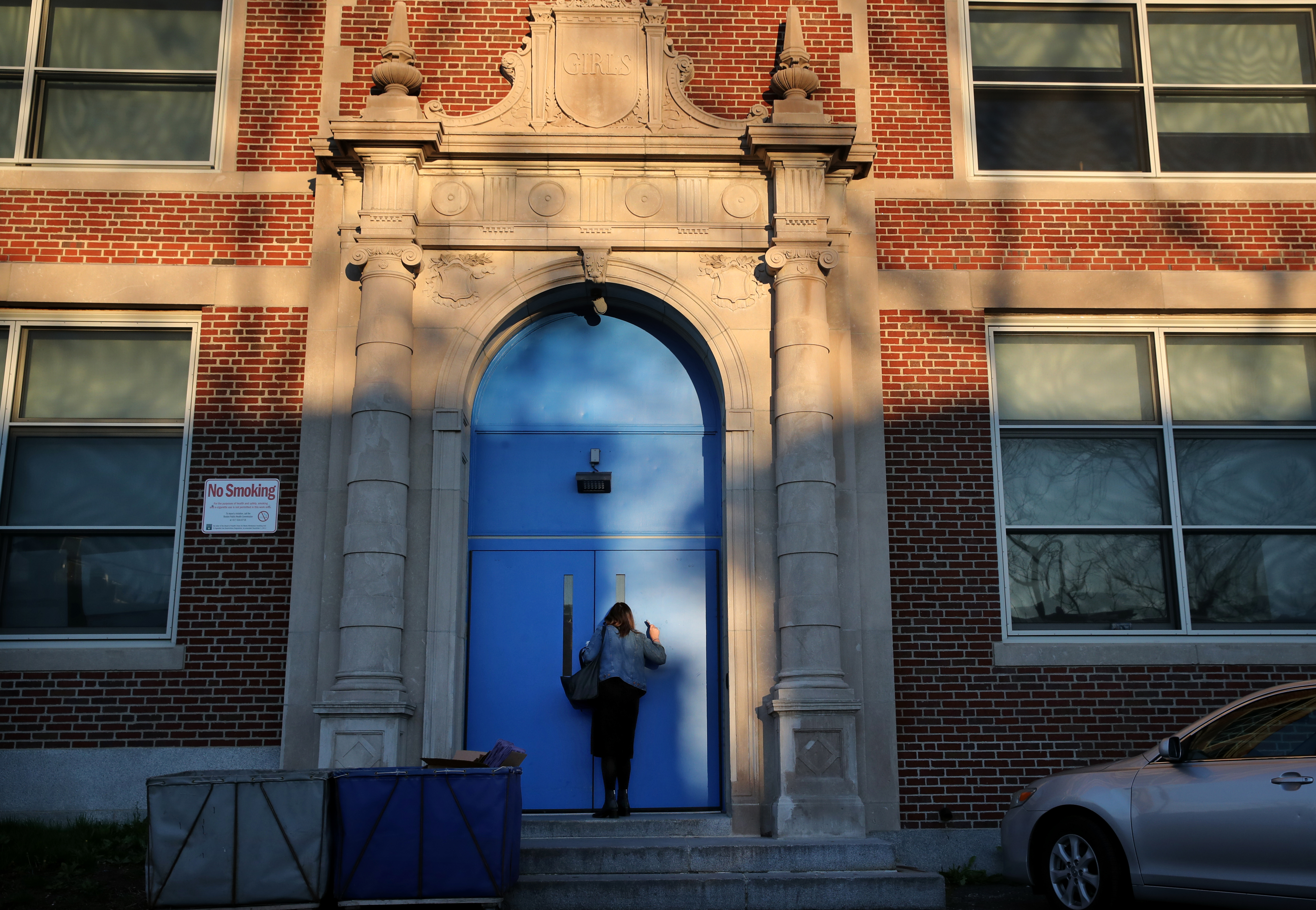 Counselor Jacquelyn Indrisano tried to catch a co-worker’s attention when she arrived for work at 6:15 a.m. at East Boston High School.