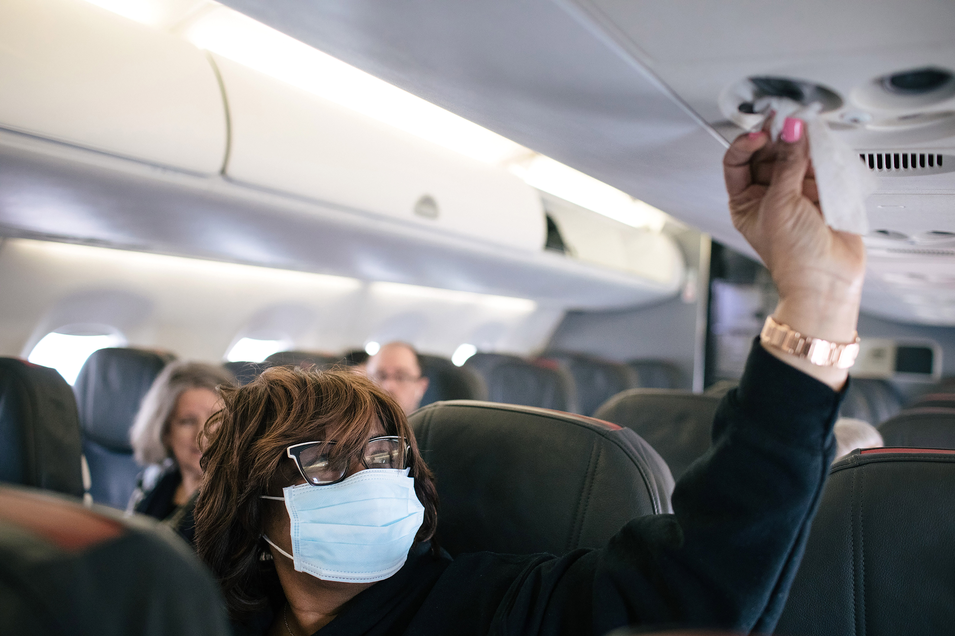 Acquanetta Garth wiped down her surroundings on an American Airlines flight at the Detroit Metropolitan Wayne County Airport.