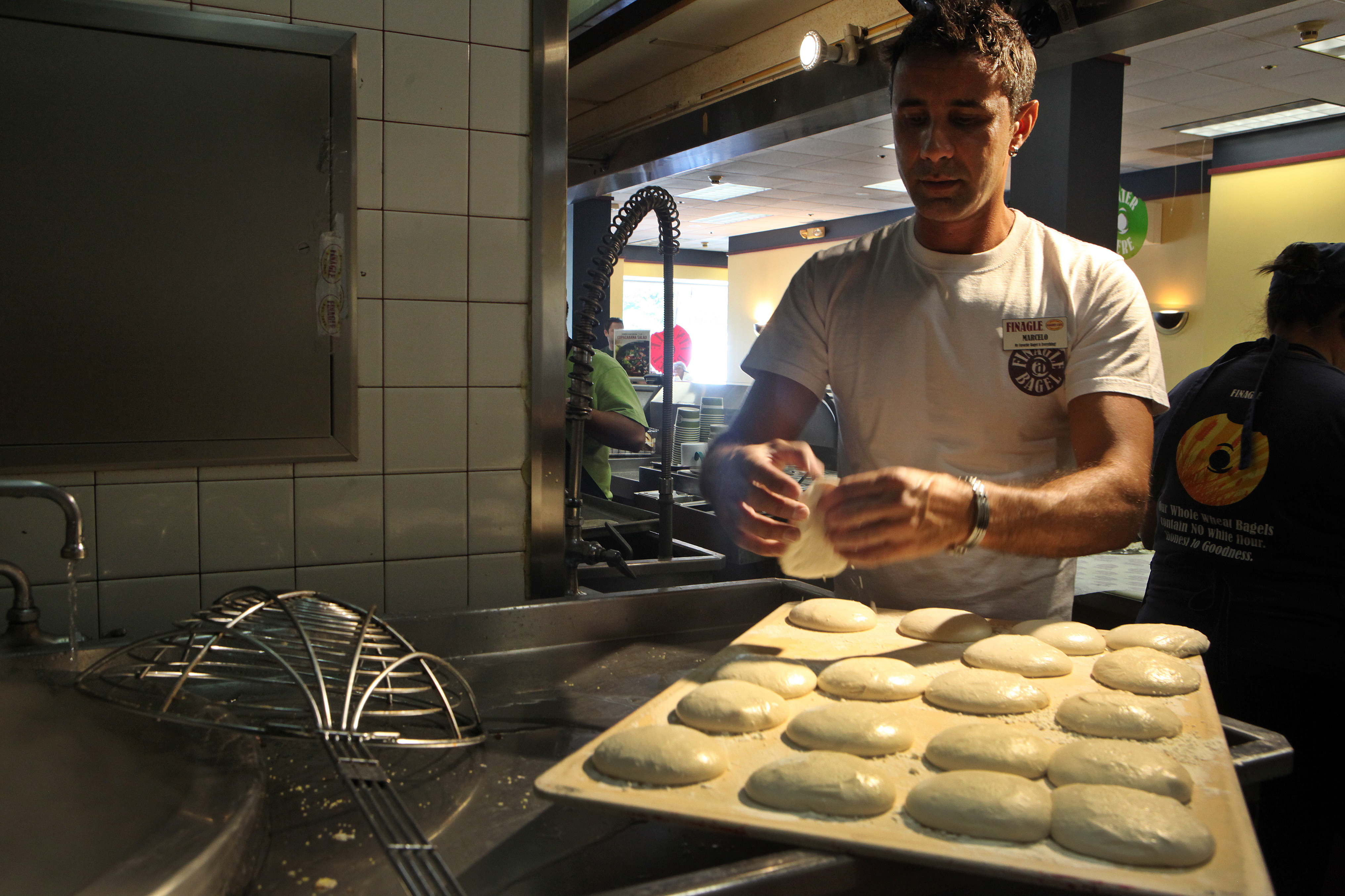 Marcelo Mathias prepares bialys at Finagle a Bagle in Chestnut Hill.