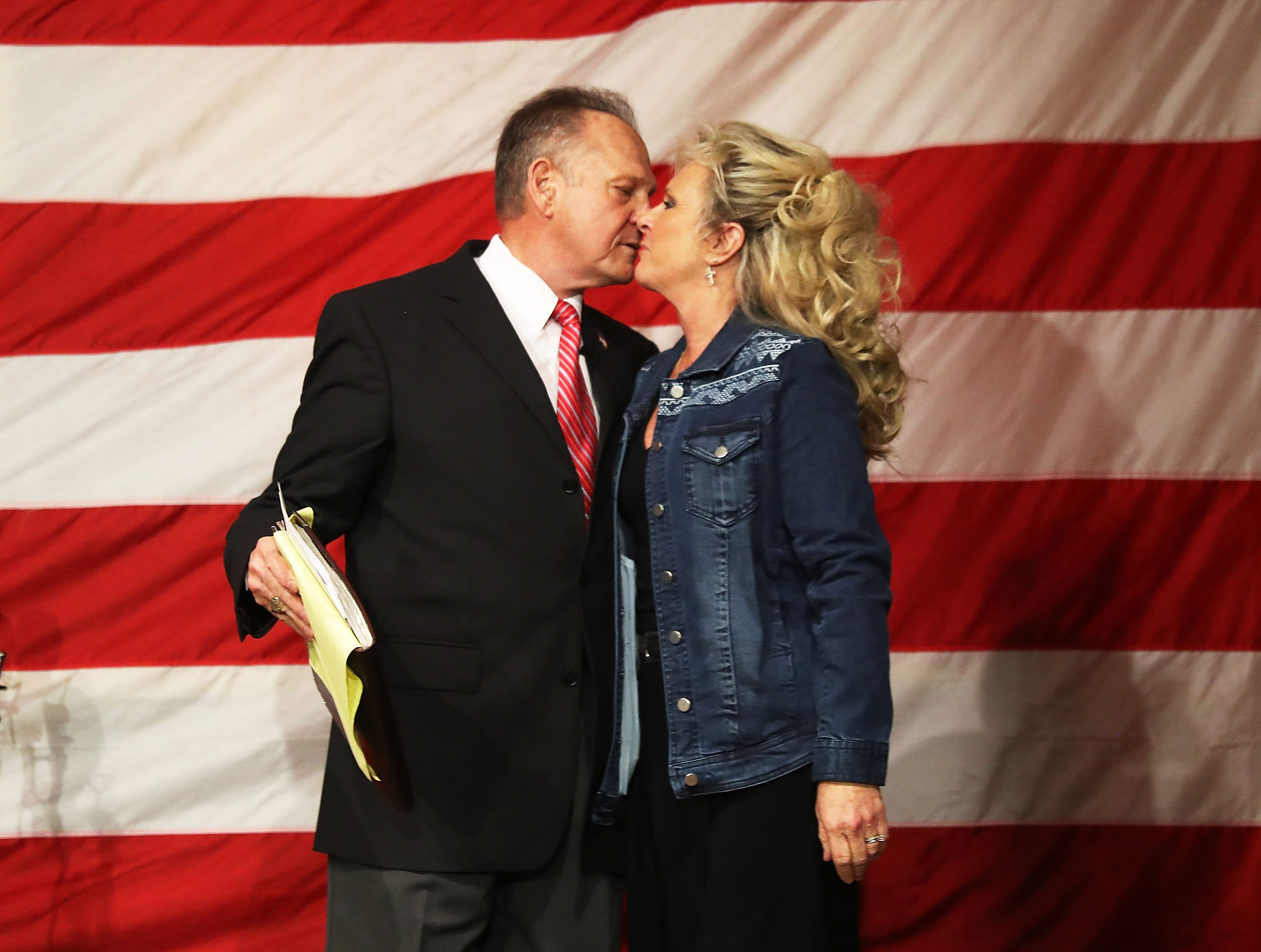 Roy Moore kissed his wife Kayla Moore during a campaign event at Oak Hollow Farm.