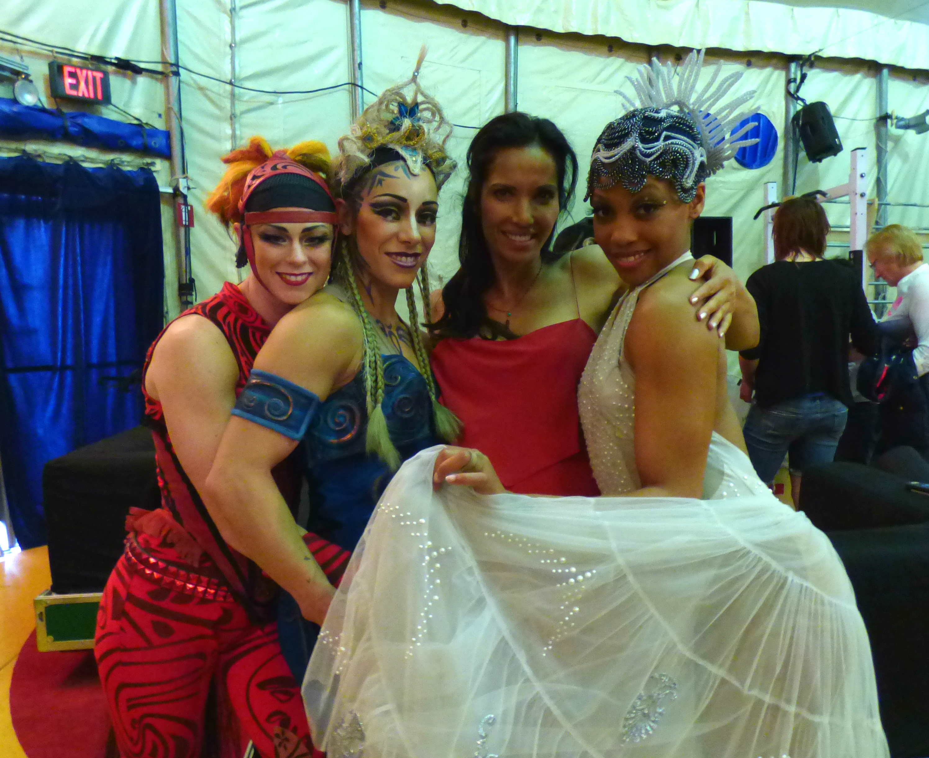 “Top Chef’’ host Padma Lakshmi backstage with three Cirque du Soleil performers.