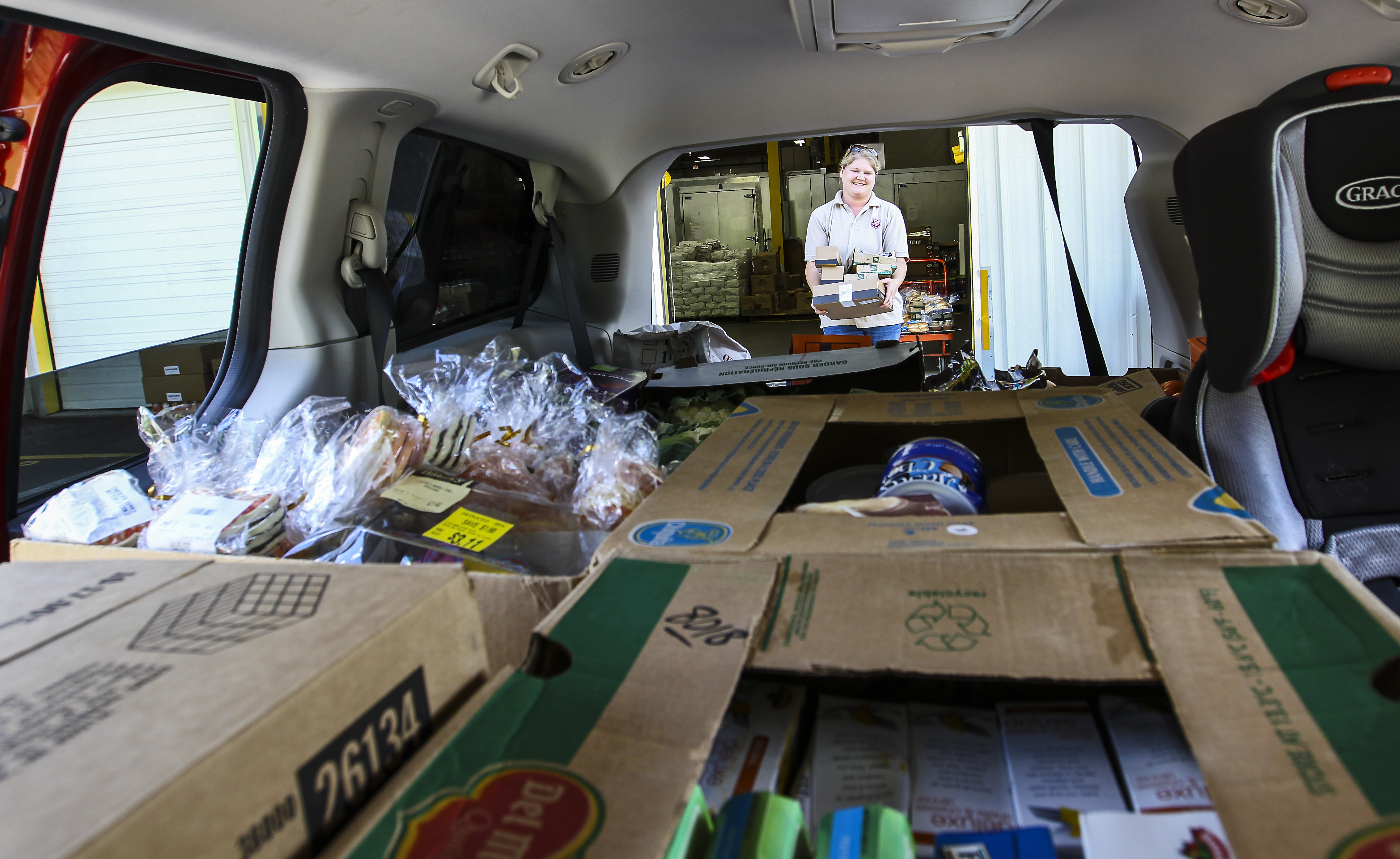 Salvation Army captain Sally Warren packed her minivan with food for distribution.