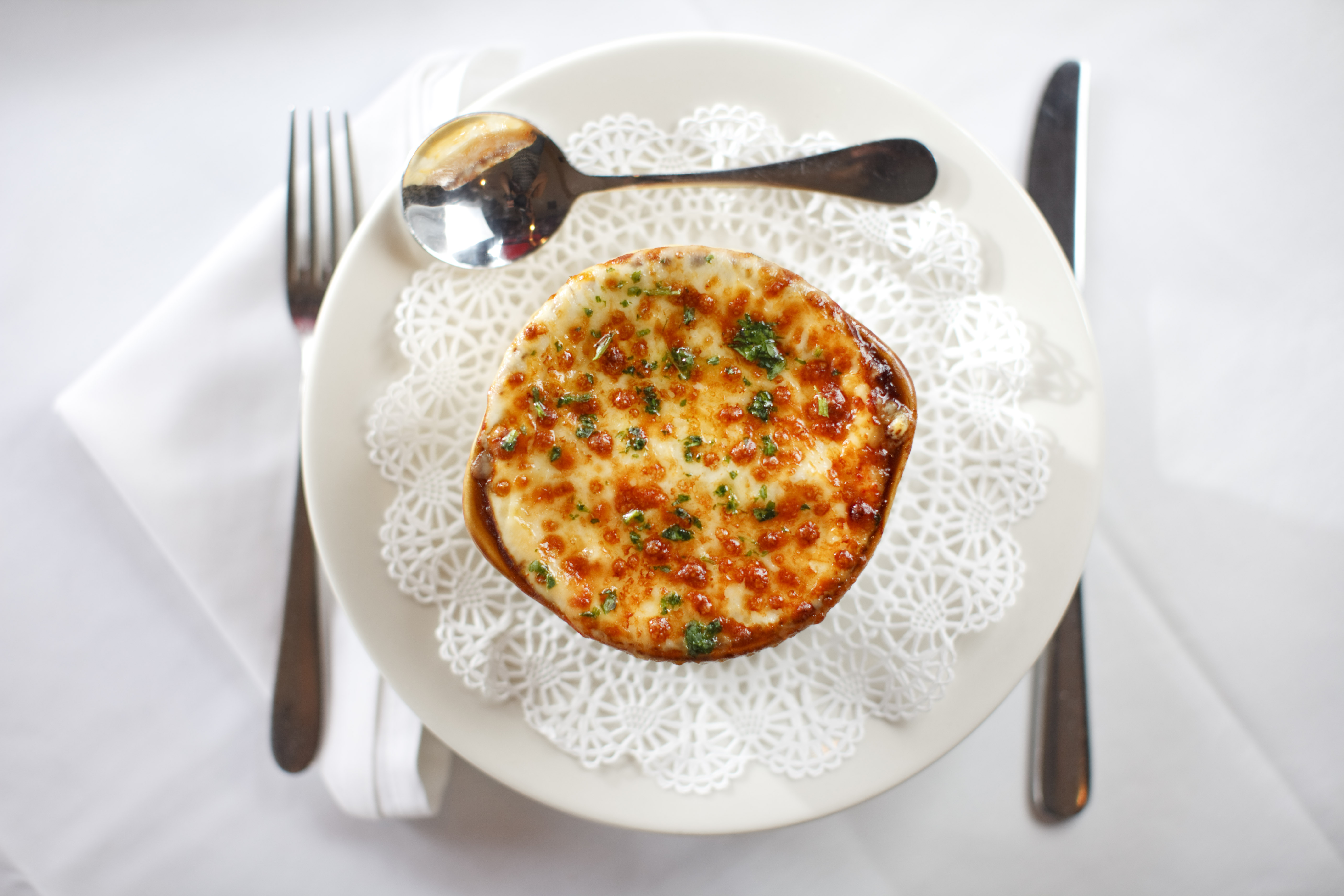 Onion soup covered with Gruyere and Munster cheeses.