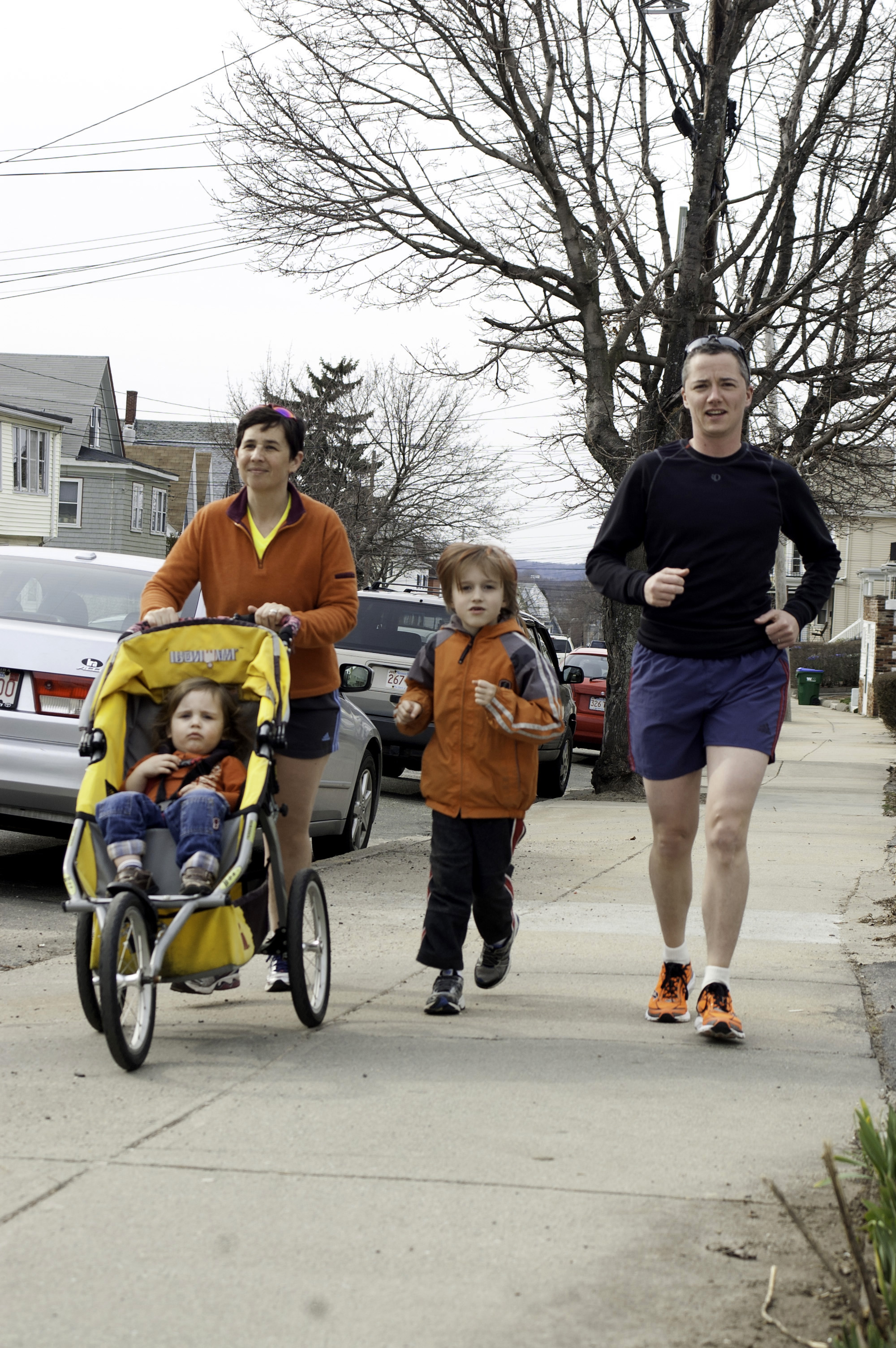 Carolyn and Jesse Edsell-Vetter during a training run with their children, Ethan, 2, and Yoni, 7.