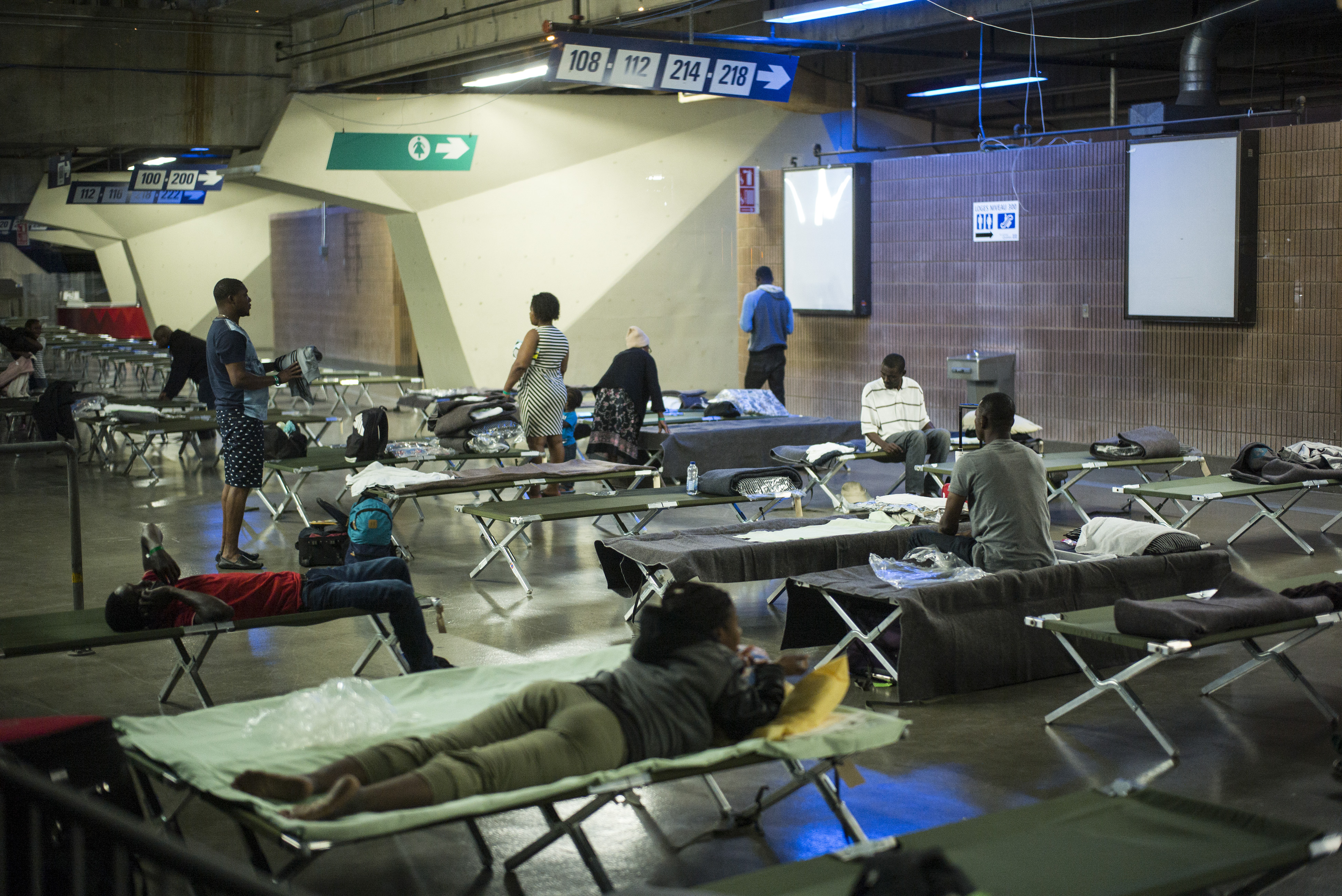Olympic Stadium is sheltering hundreds of an estimated 8,000 Haitians who have fled to Quebec from the United States since June.
