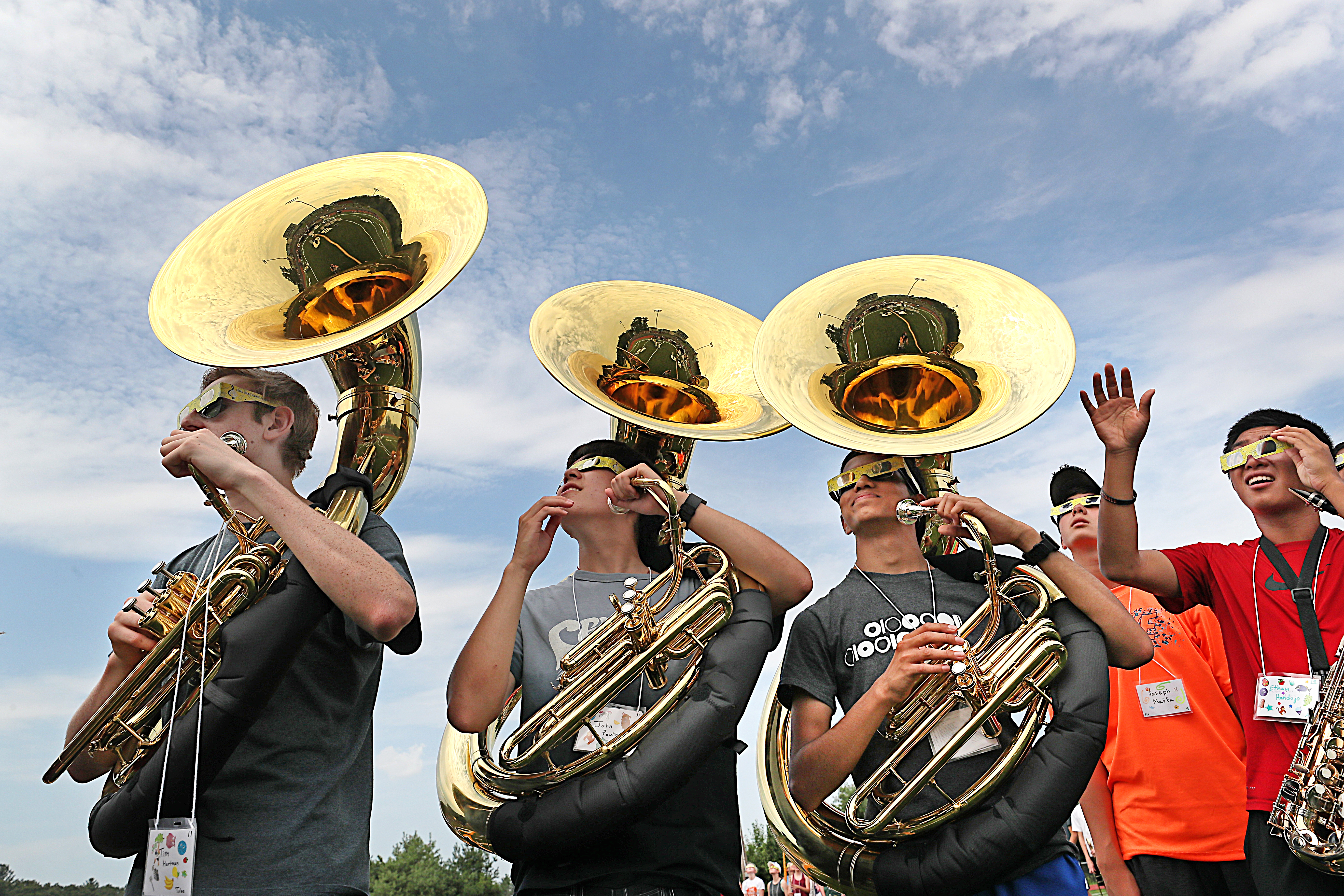 Members of Acton-Boxborough Regional High School’s marching band took a moment after practice to look at the sky.