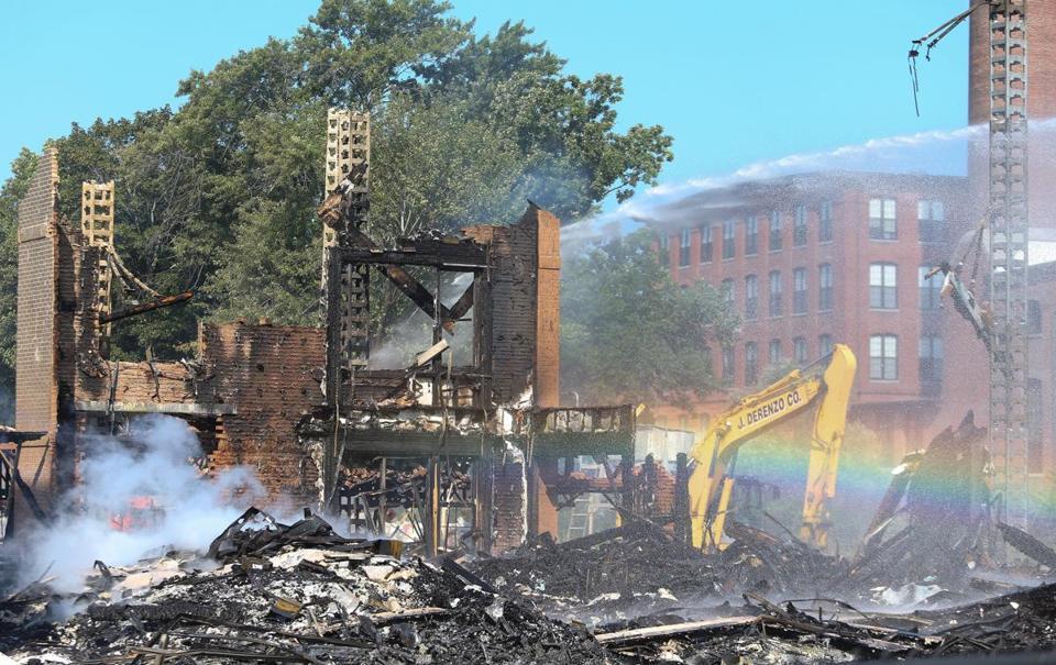 Smoldering rubble could be seen Sunday.