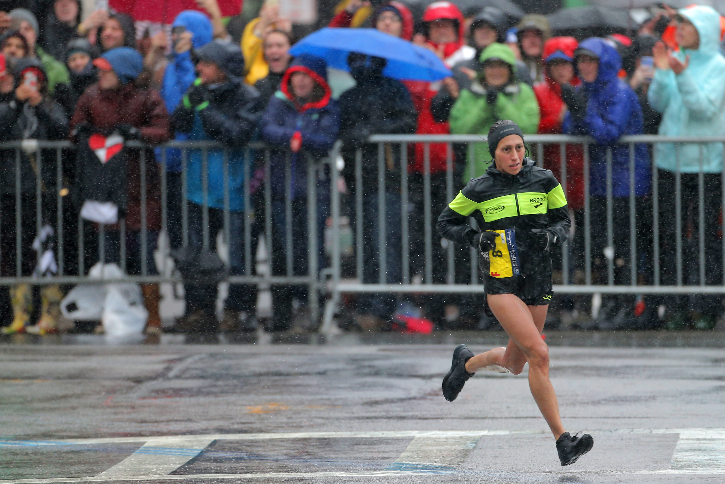 Linden rounds the corner onto Hereford Street in rainy conditions last year, on her way to victory.