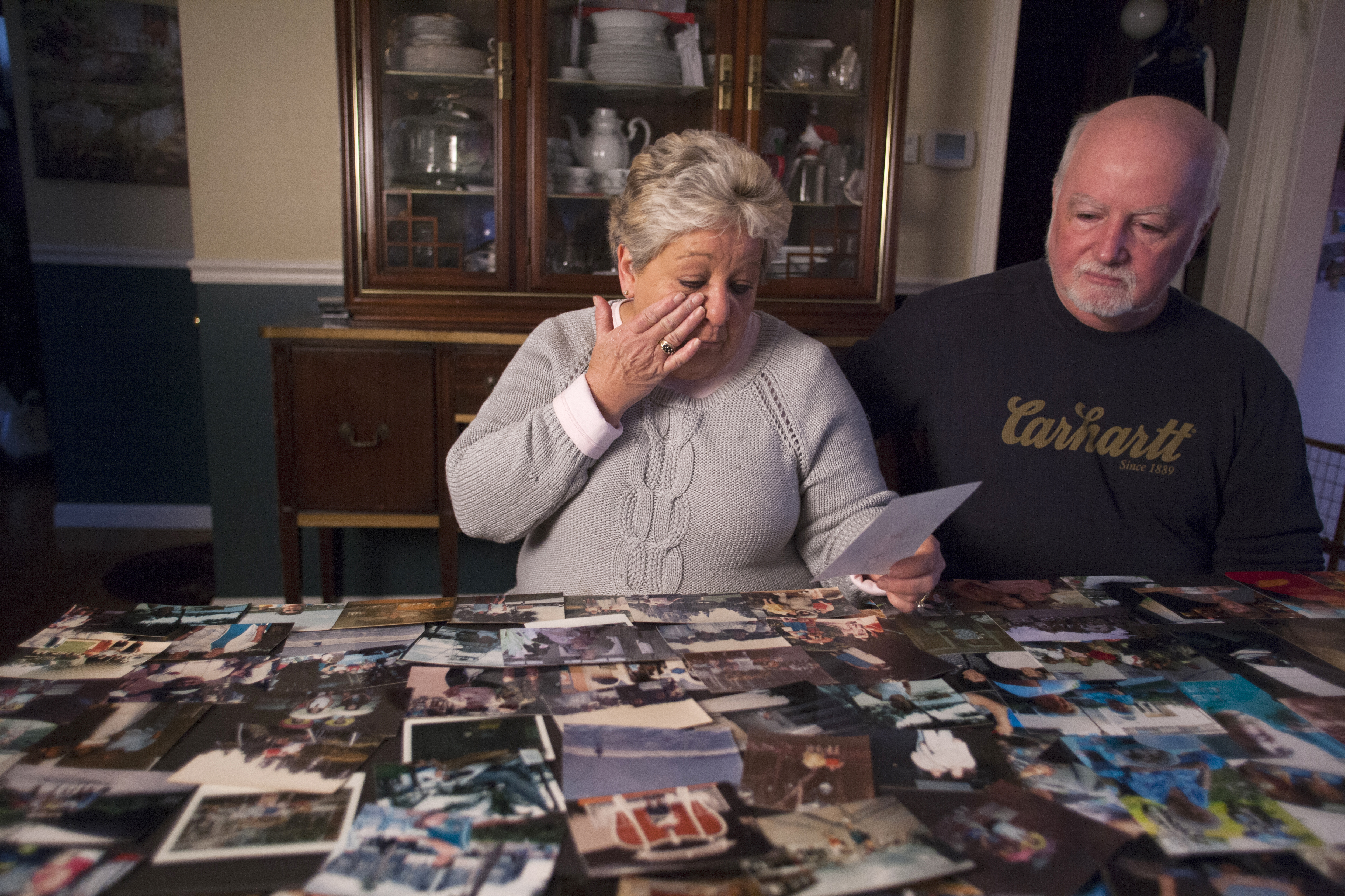 Brenda Murray of Lynn and her husband, Doug, looked over photos of her mother, Mary Meuse, that were displayed at Meuse’s funeral.
