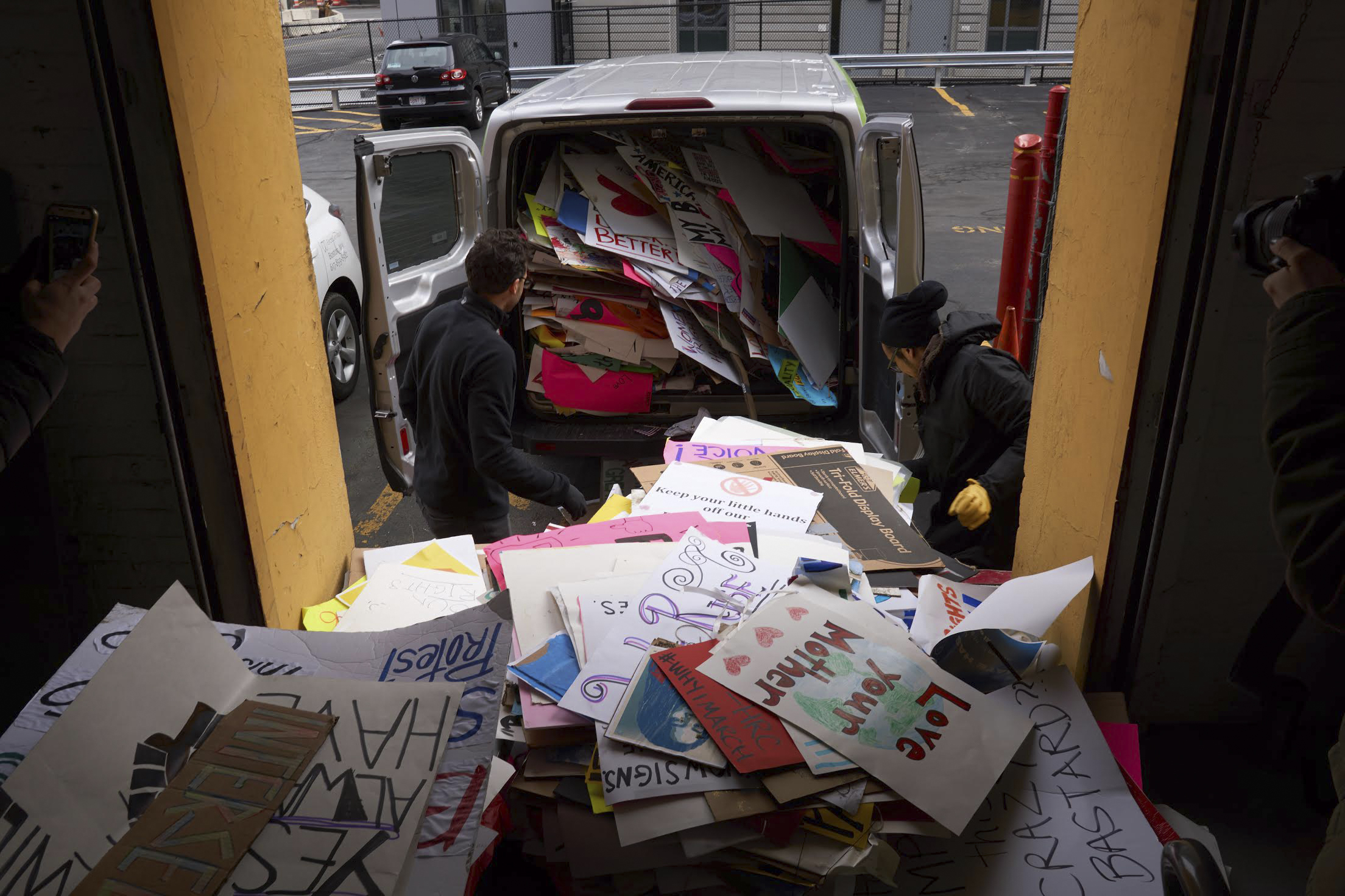Volunteers packed as many protest signs as they could manage into a rented van in hopes of preserving the messages for a historical record at Northeastern University.