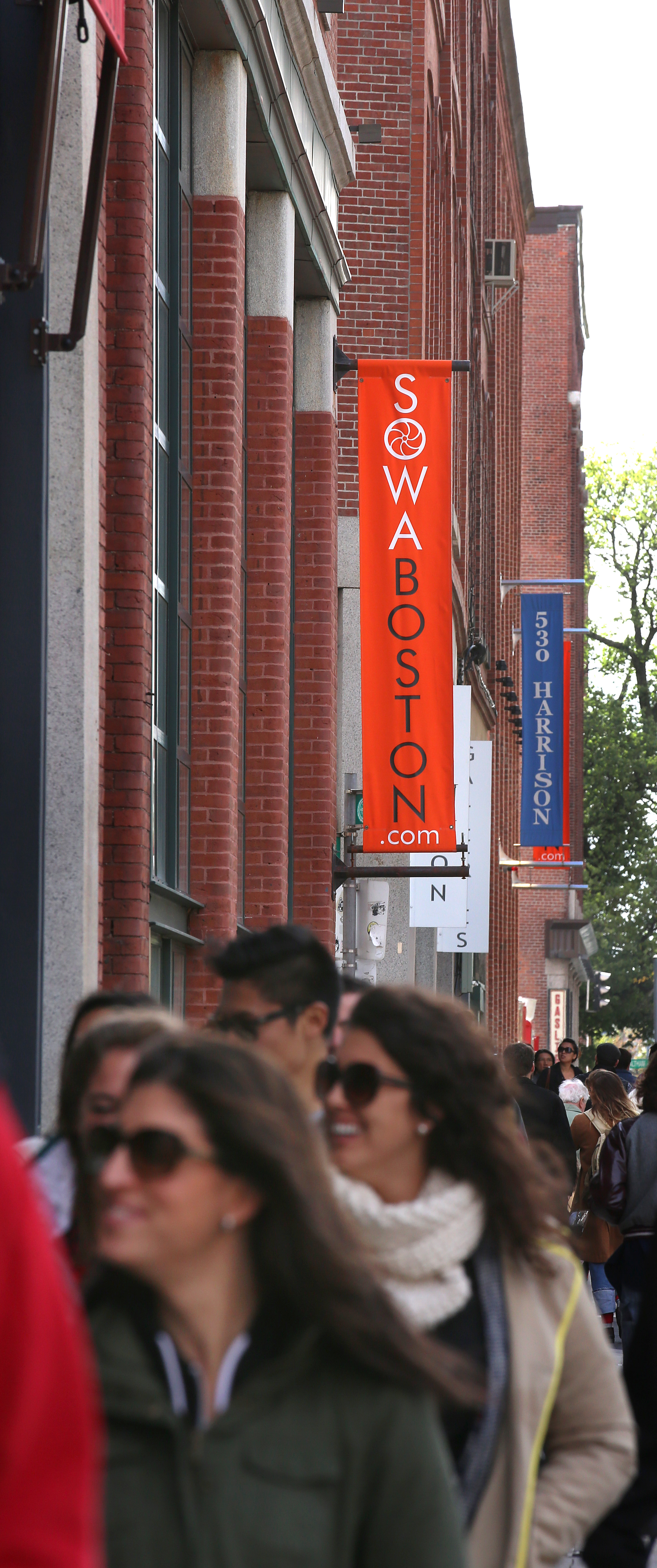 Crowds moved along Harrison Avenue on Sunday.
