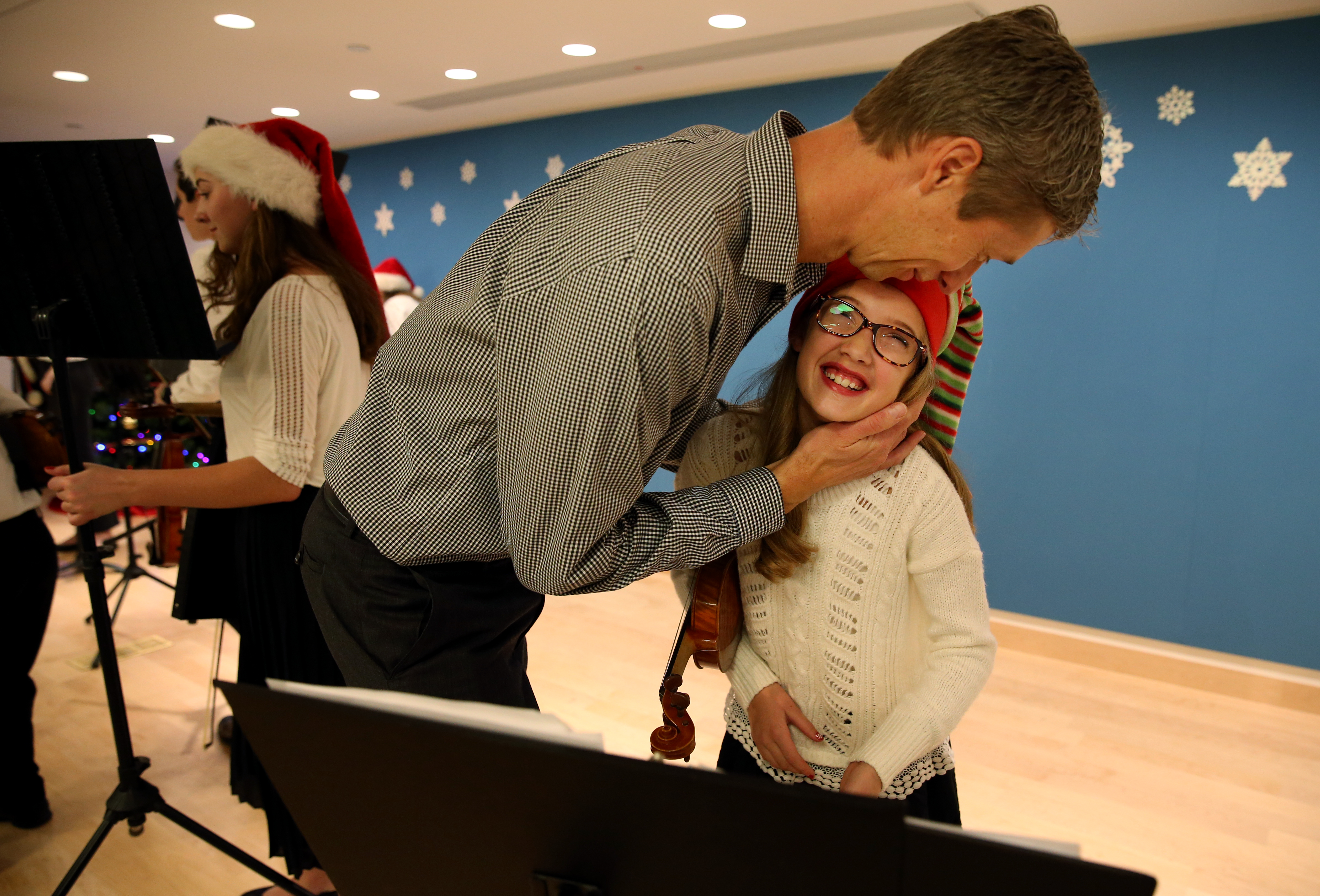 Chad Fellows (left) congratulated his daughter, Sophie following the holiday concert.