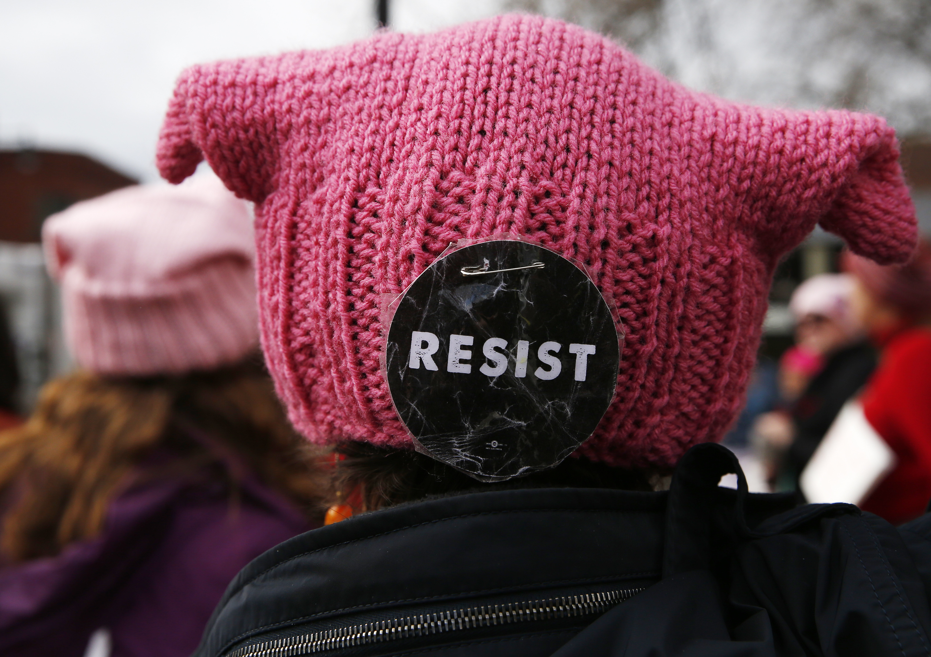 A “resist” button was seen on the back of a hat.