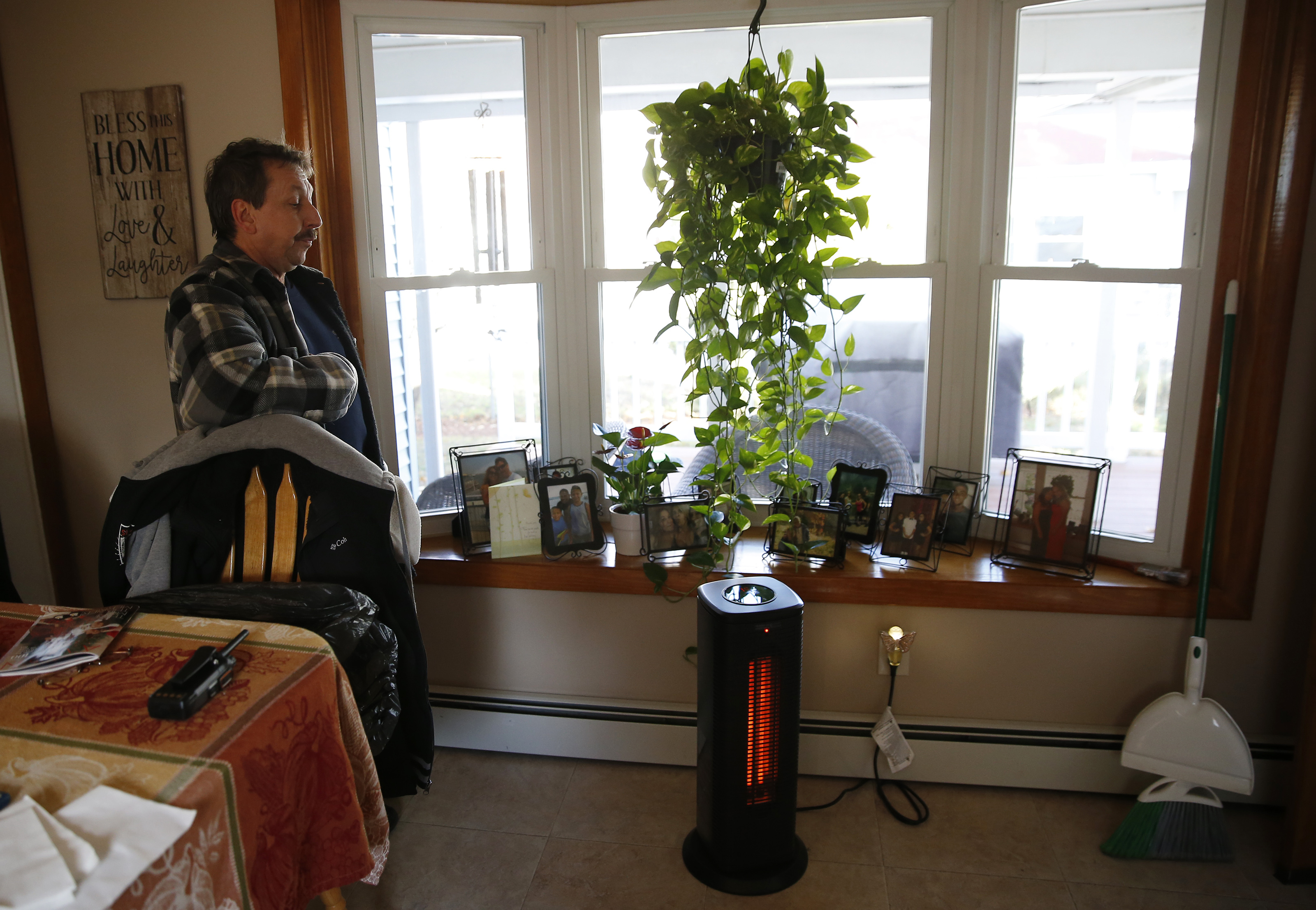 Kyle Ducharme has been using space heaters to keep warm at his home in South Lawrence.