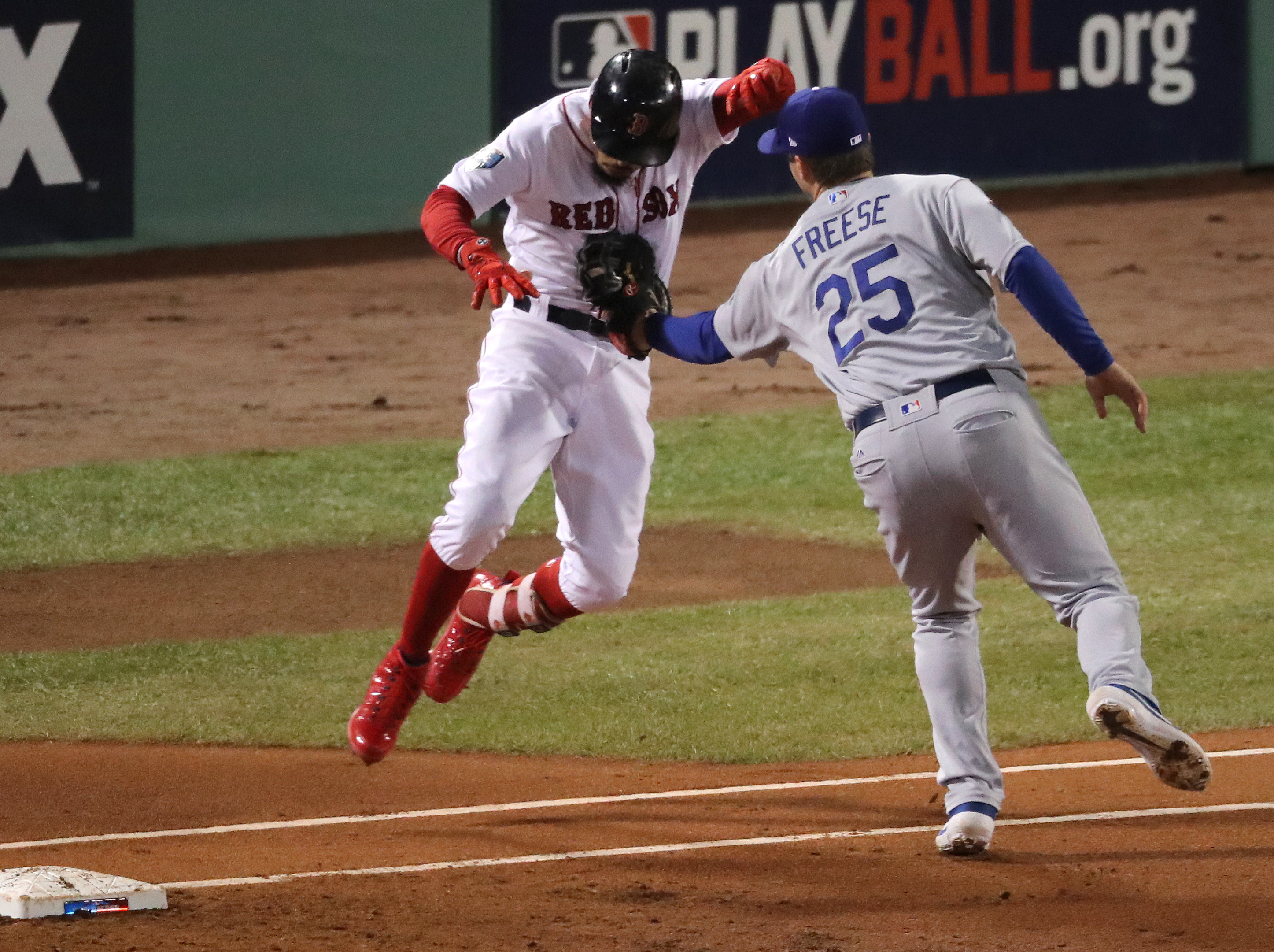 Mookie Betts was tagged out by David Freese in the first inning.