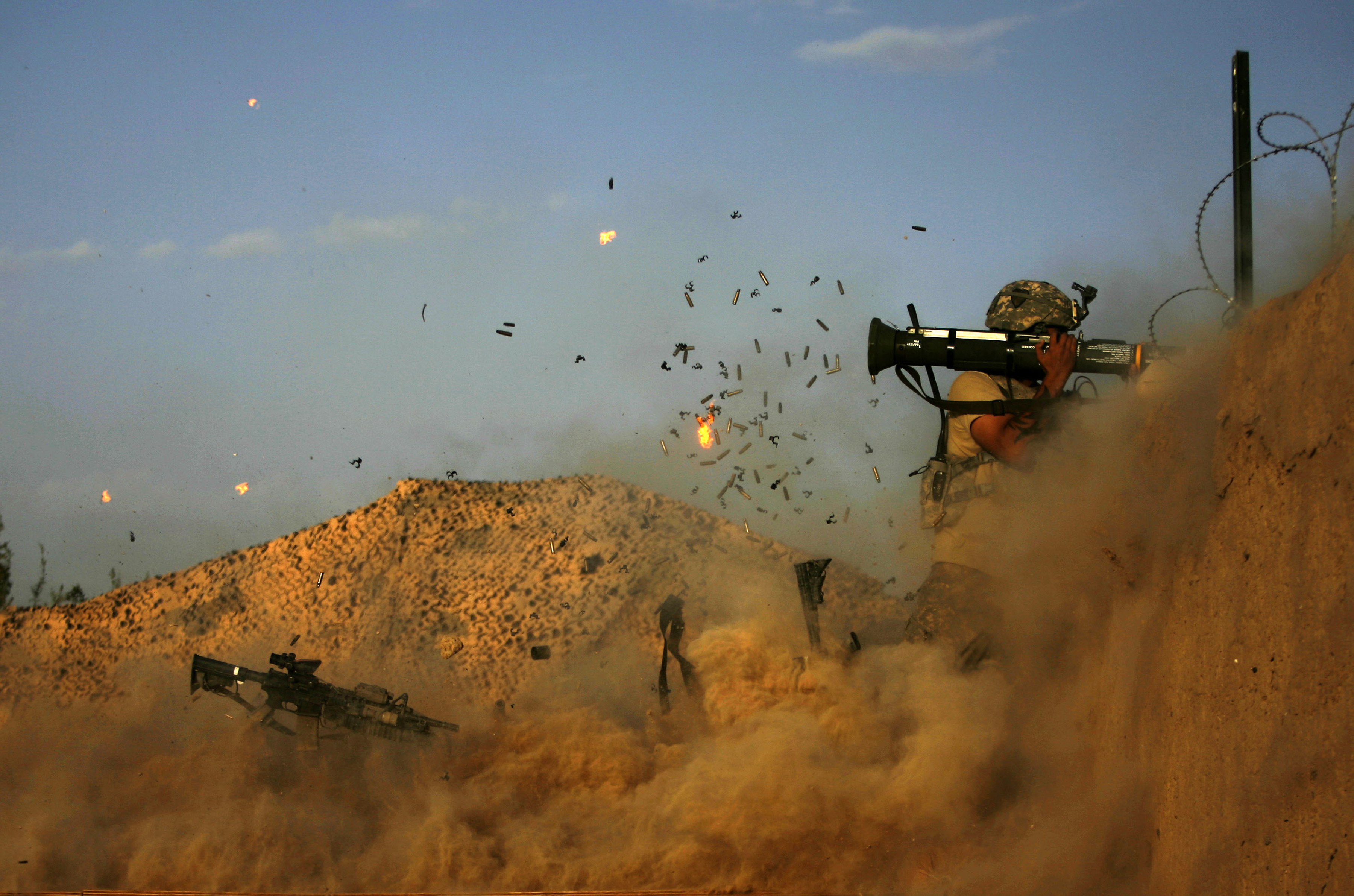 A US soldier with the 101st Airborne Division fires an AT-4 as Combat Outpost Nolen on the outskirts of the village of Jellawar came under Taliban attack on September 11, 2010.